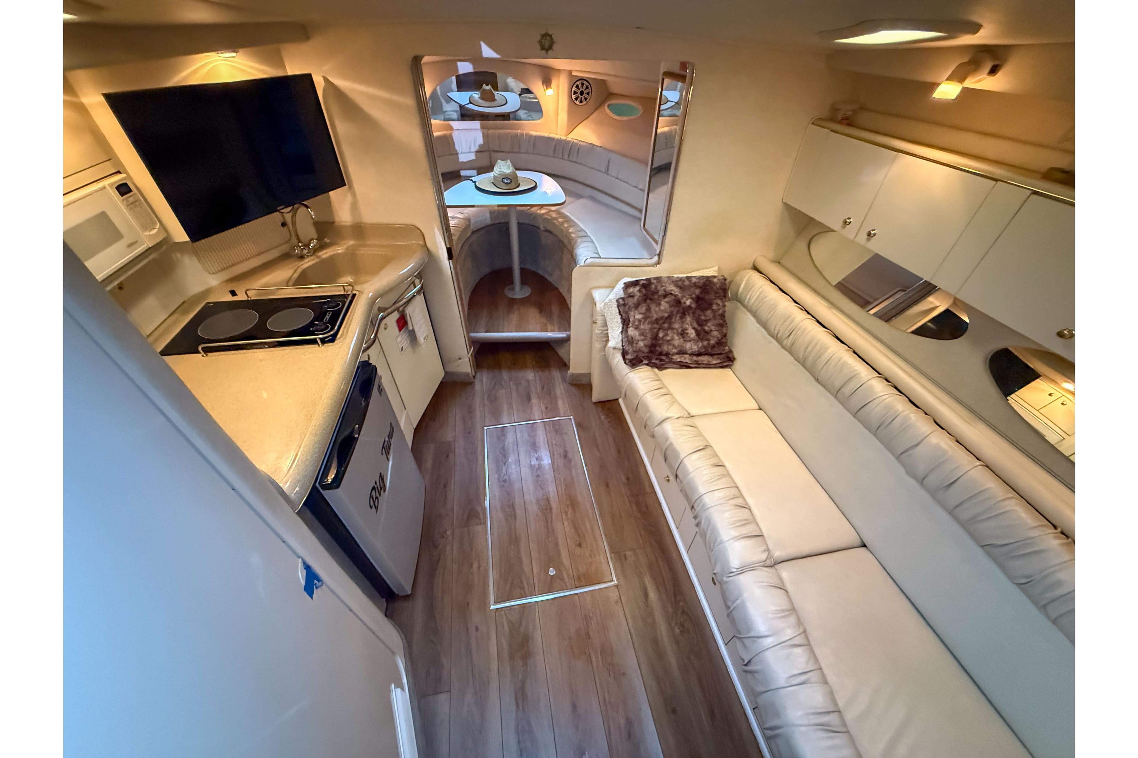 Luxurious interior of a 1997 Sea Ray 330 Express Cruiser with modern amenities.
