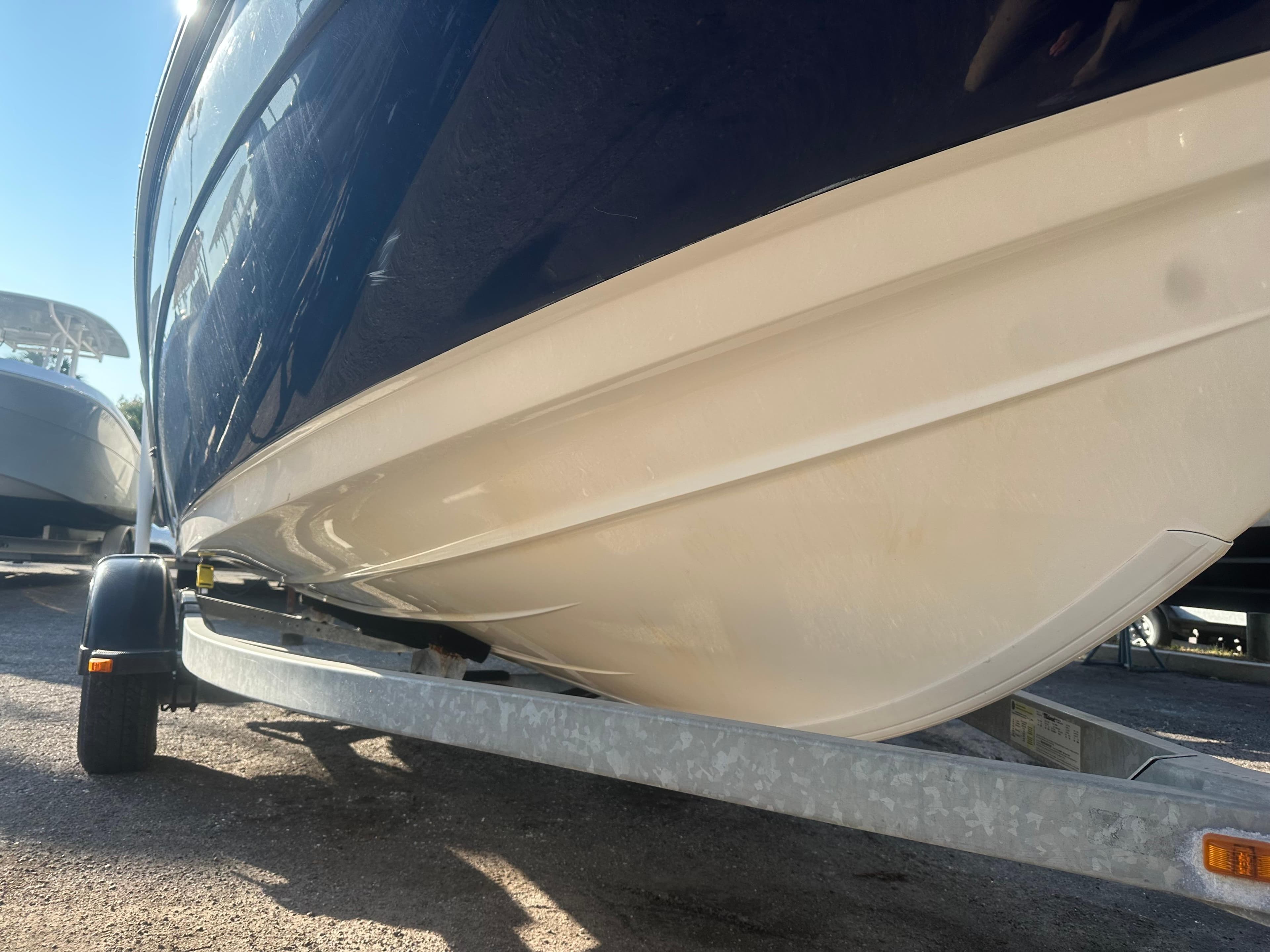 2013 Yamaha Boats SX192 on trailer, showcasing sleek hull design.