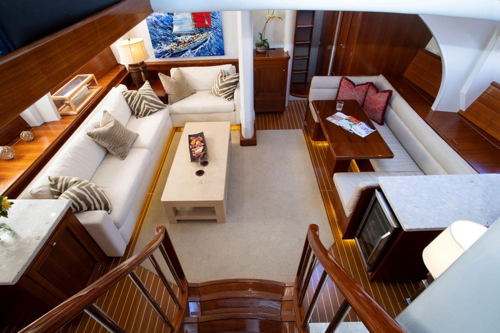 Luxurious interior of 1993 Able Custom 97' yacht with elegant seating and wooden finishes.
