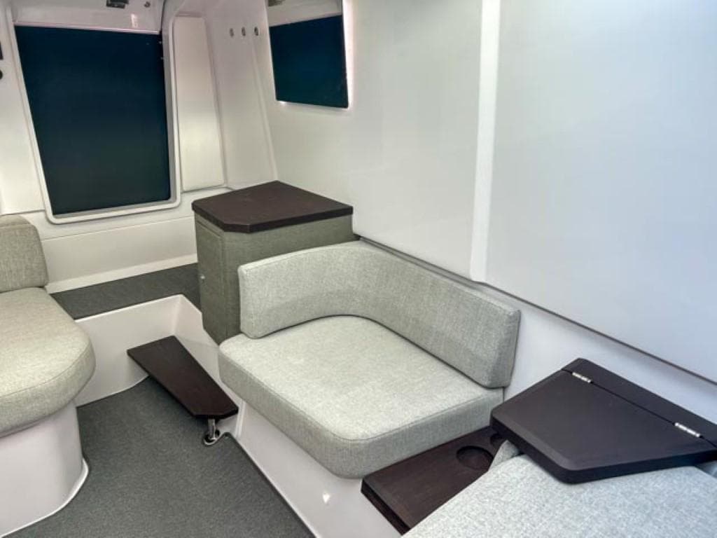 Interior of 2024 Axopar 37 Sun Top, featuring modern seating and sleek design.