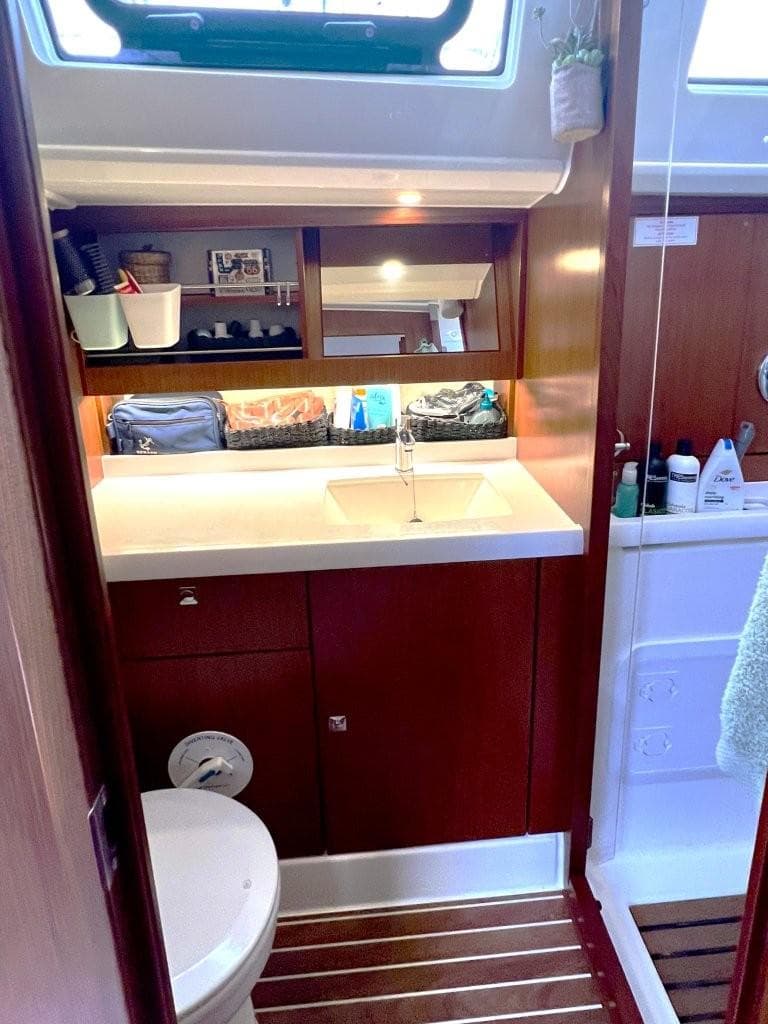 Bavaria 46 Vision 2017 yacht bathroom with wooden cabinetry and modern fixtures.