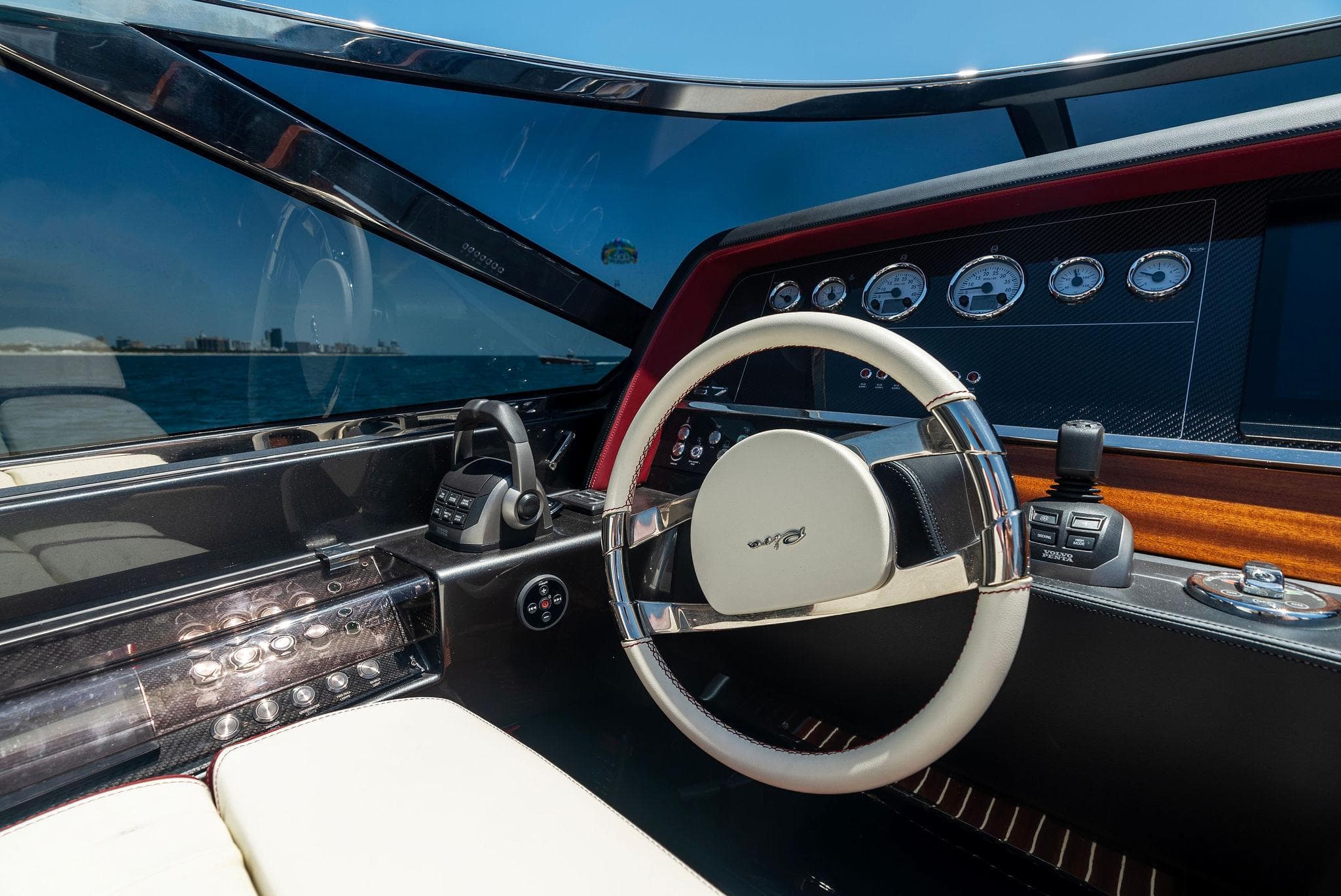 Cockpit of 2022 Riva 38 Rivamare luxury yacht with modern steering wheel and dashboard.