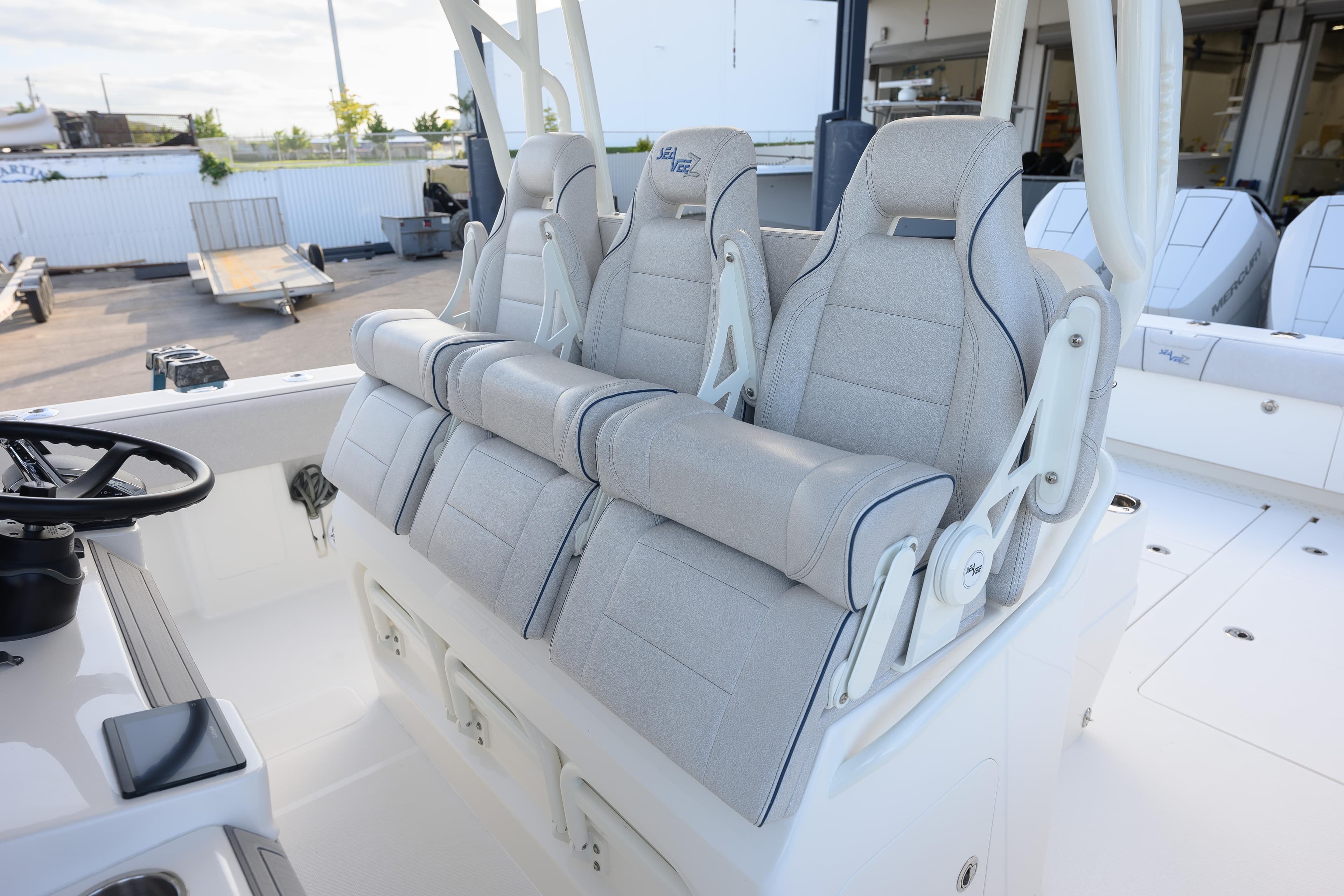 2025 SeaVee 400Z boat interior with luxurious seating and steering wheel.