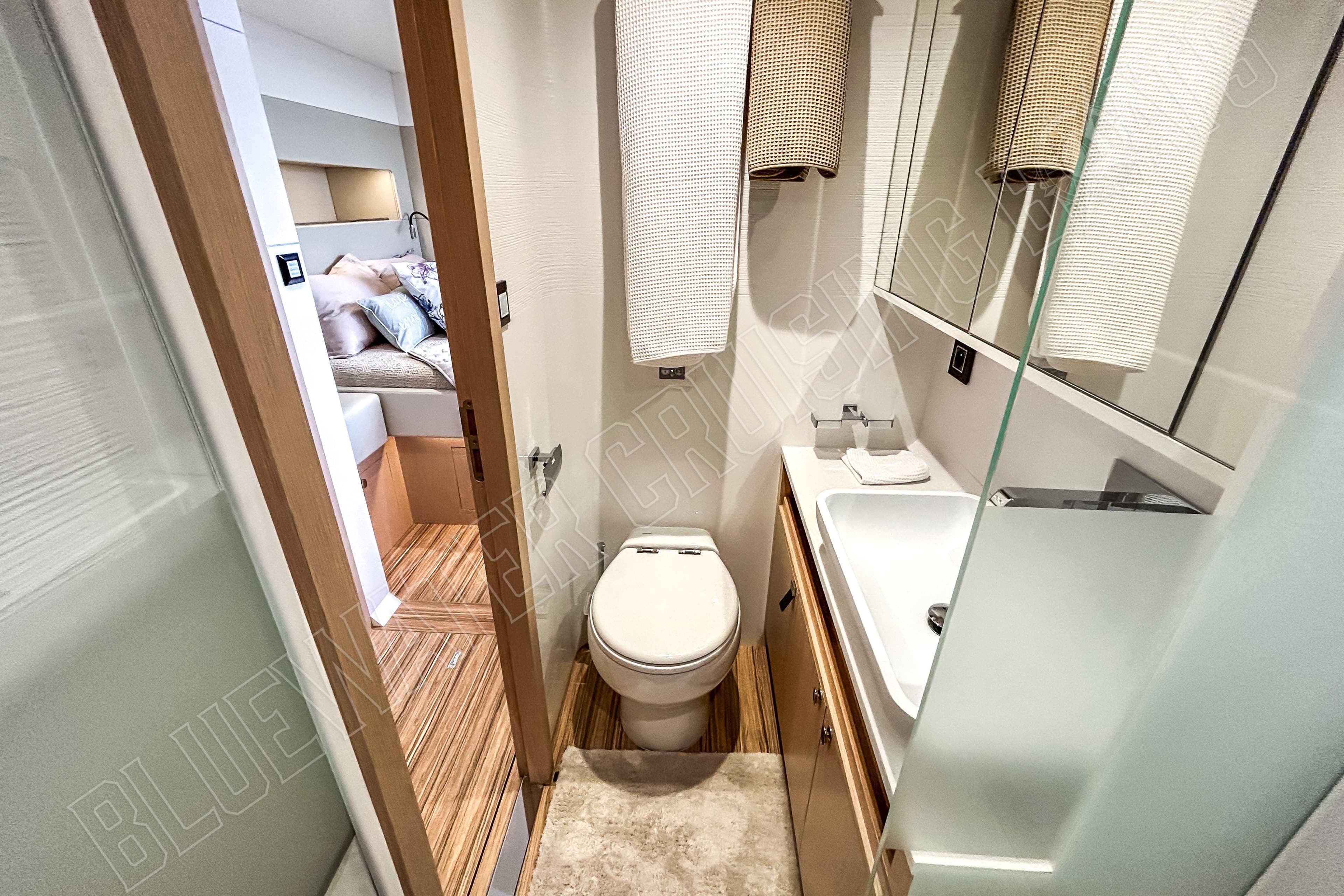 Luxury bathroom in 2025 Privilege 580 yacht, featuring modern fixtures and elegant design.
