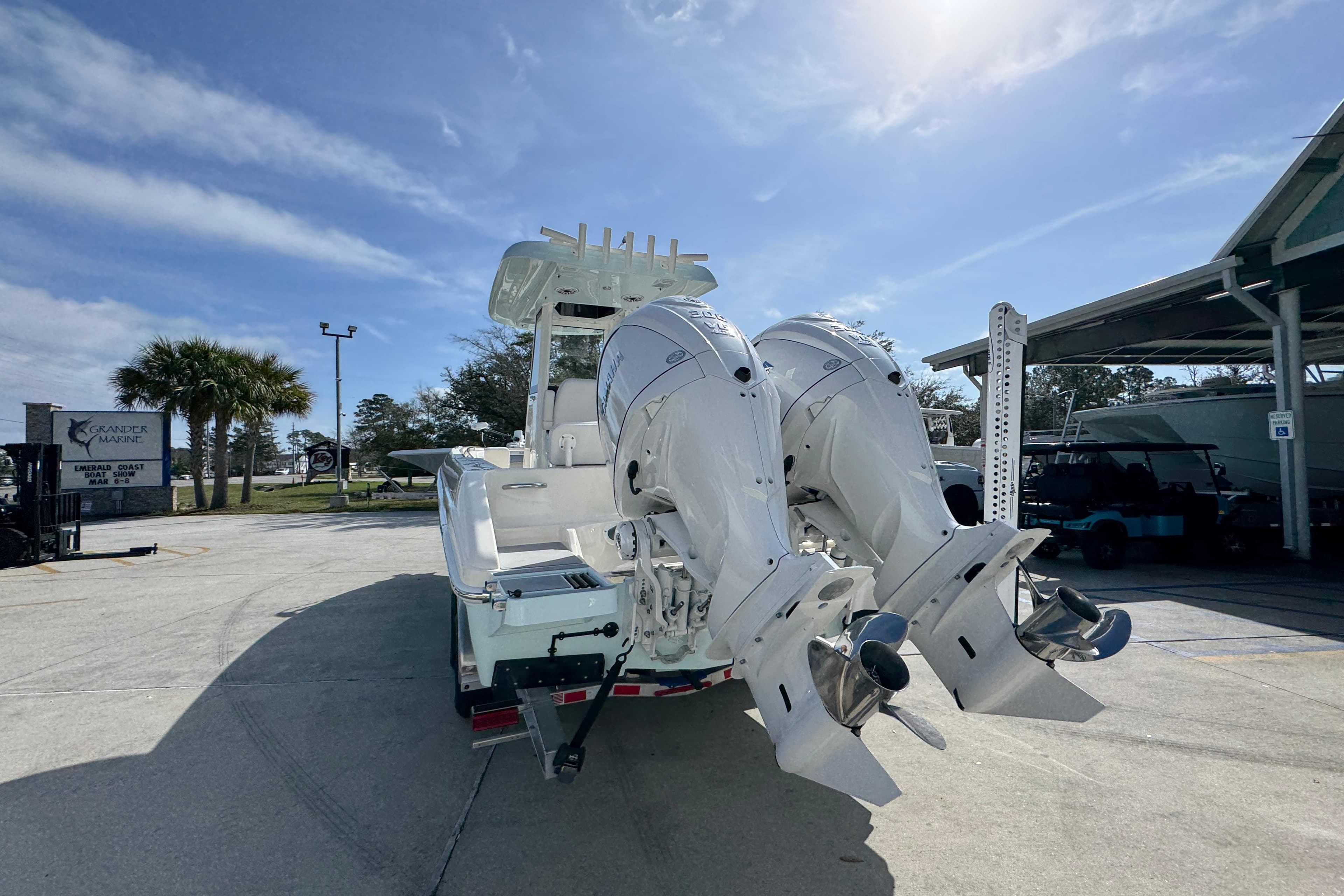 2026 Blackwood 270 LXF boat with dual outboard engines at a marina.
