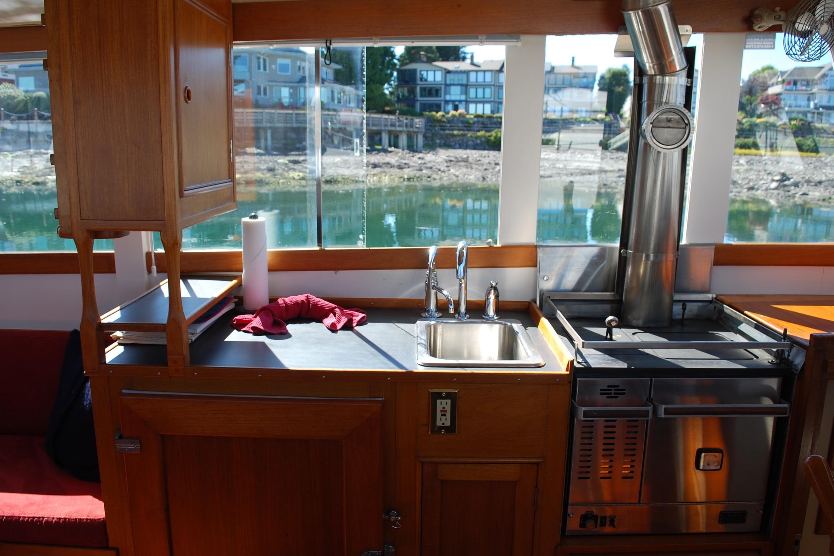 Interior of 1971 Grand Banks 36 Classic yacht with kitchen and scenic window view.