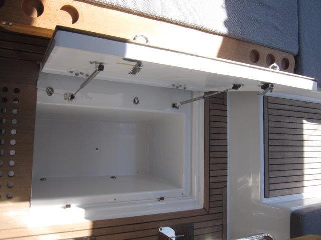 Open storage compartment on the 2025 Jeanneau Yacht 65 deck.