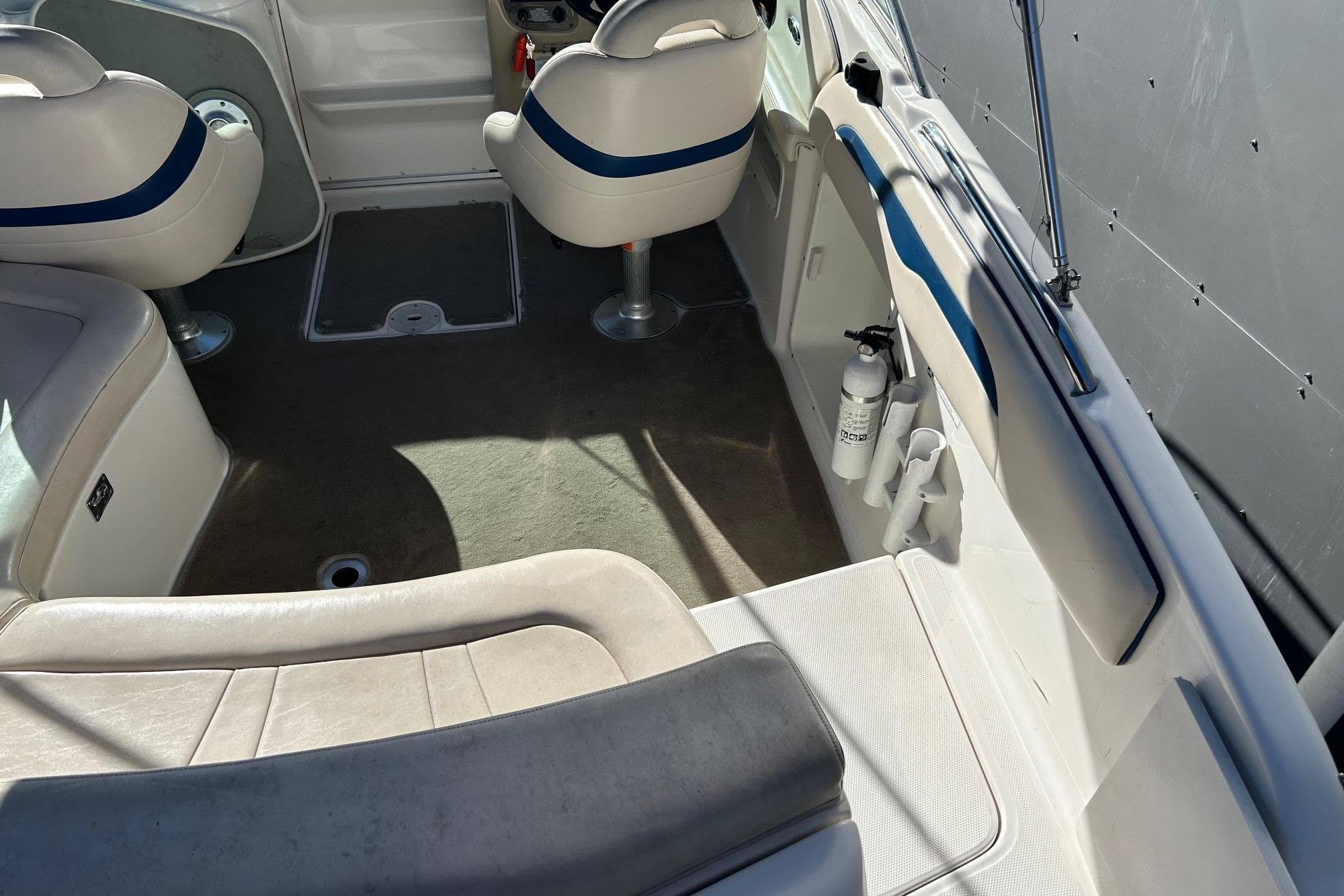 Interior of a 2001 Chaparral 235 SSi boat with seating and safety equipment.