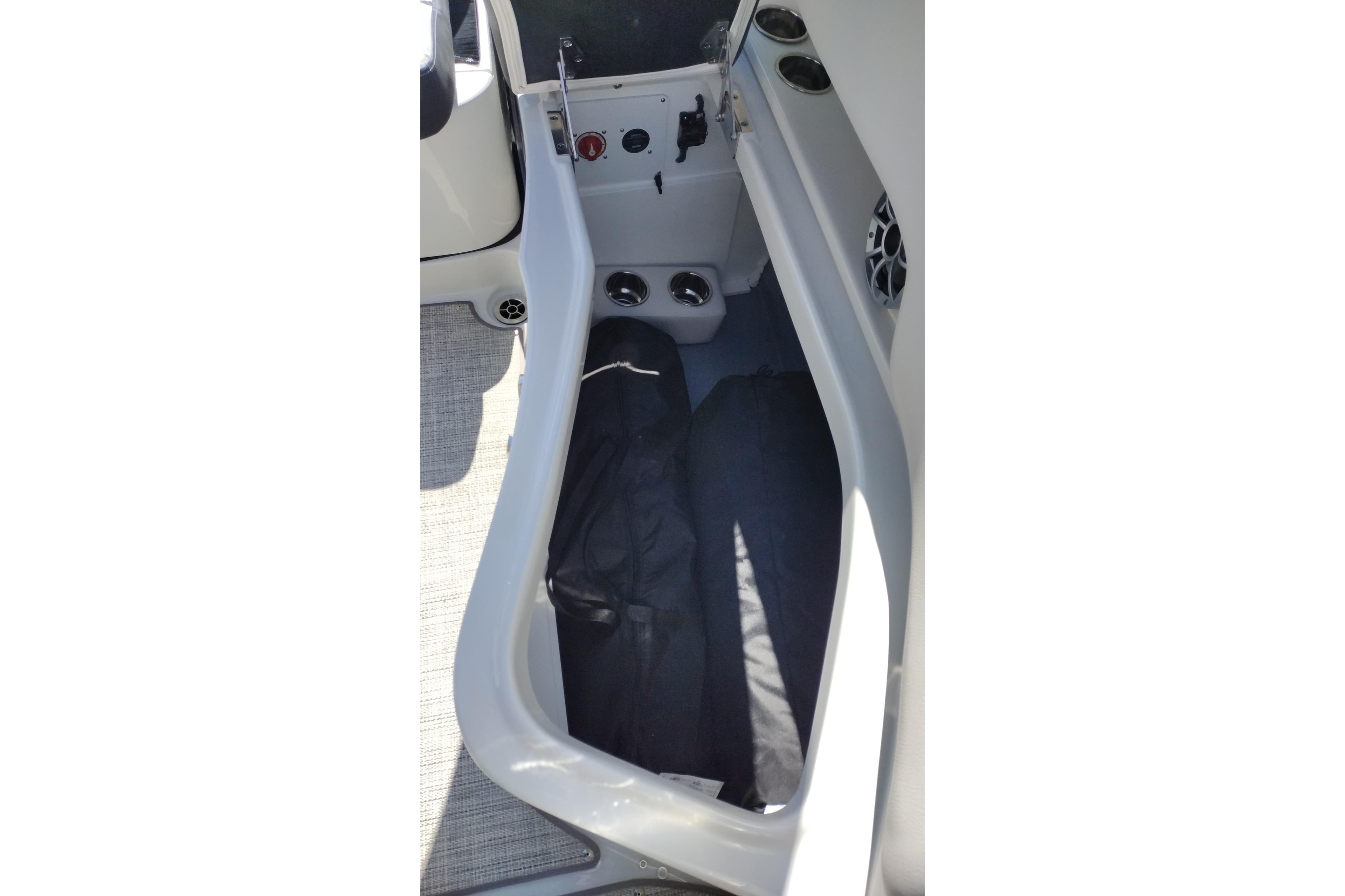 Storage compartment in 2026 Crownline Eclipse E255 boat interior.
