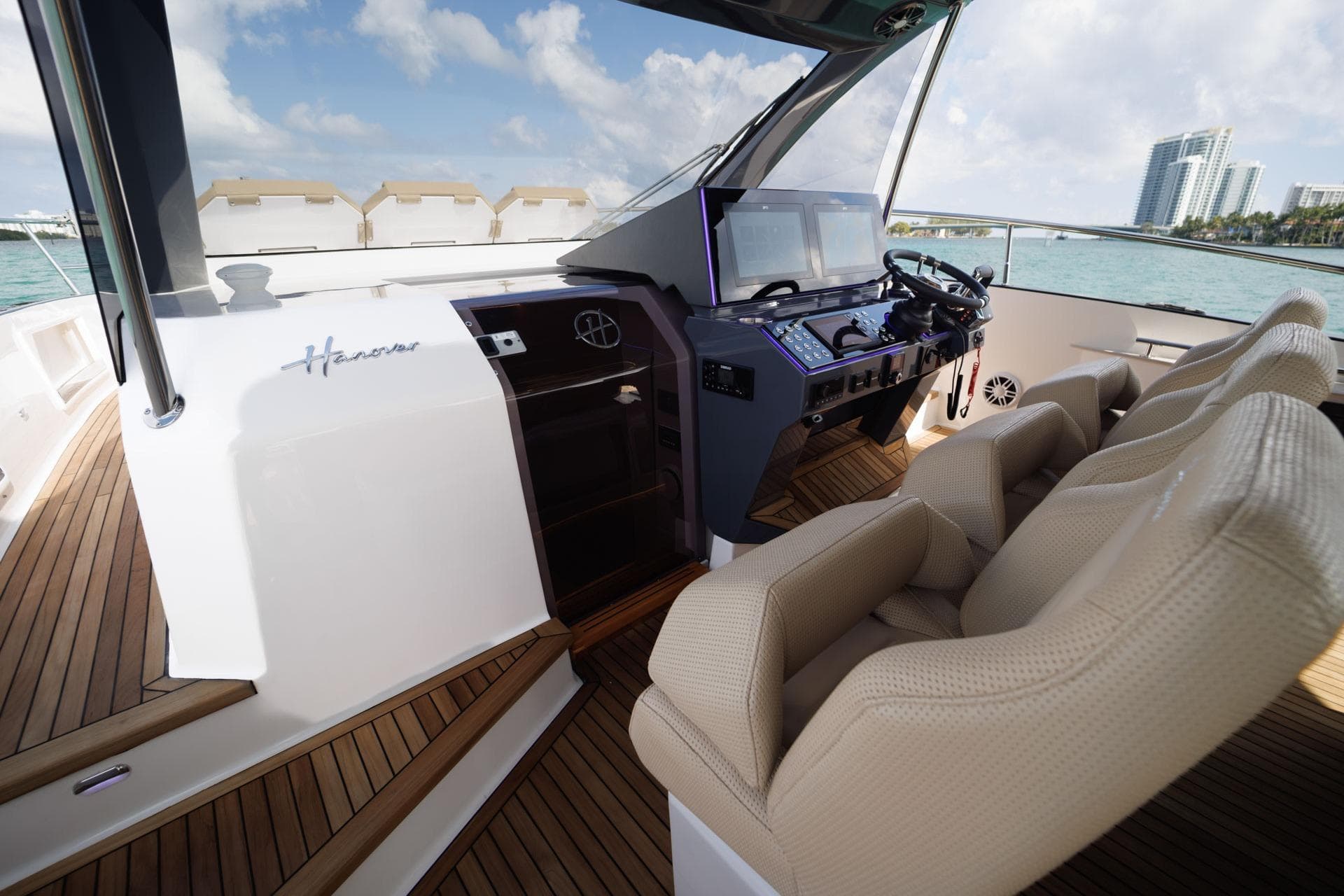 Luxurious Hanover 447 yacht cockpit with modern controls, plush seating, and ocean view, 2026 model.