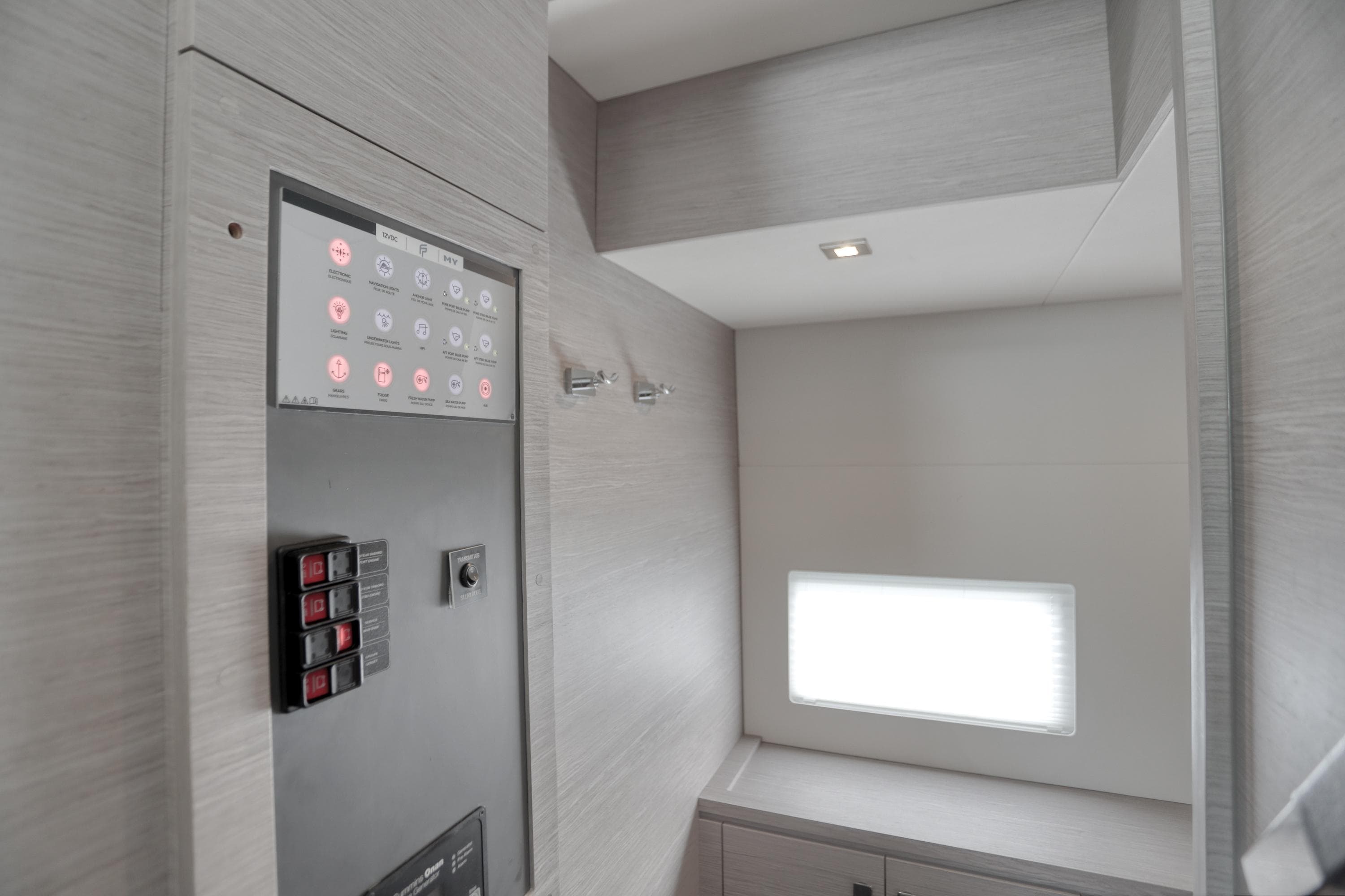 Control panel area inside 2022 Fountaine Pajot MY6 yacht, featuring modern design and lighting.