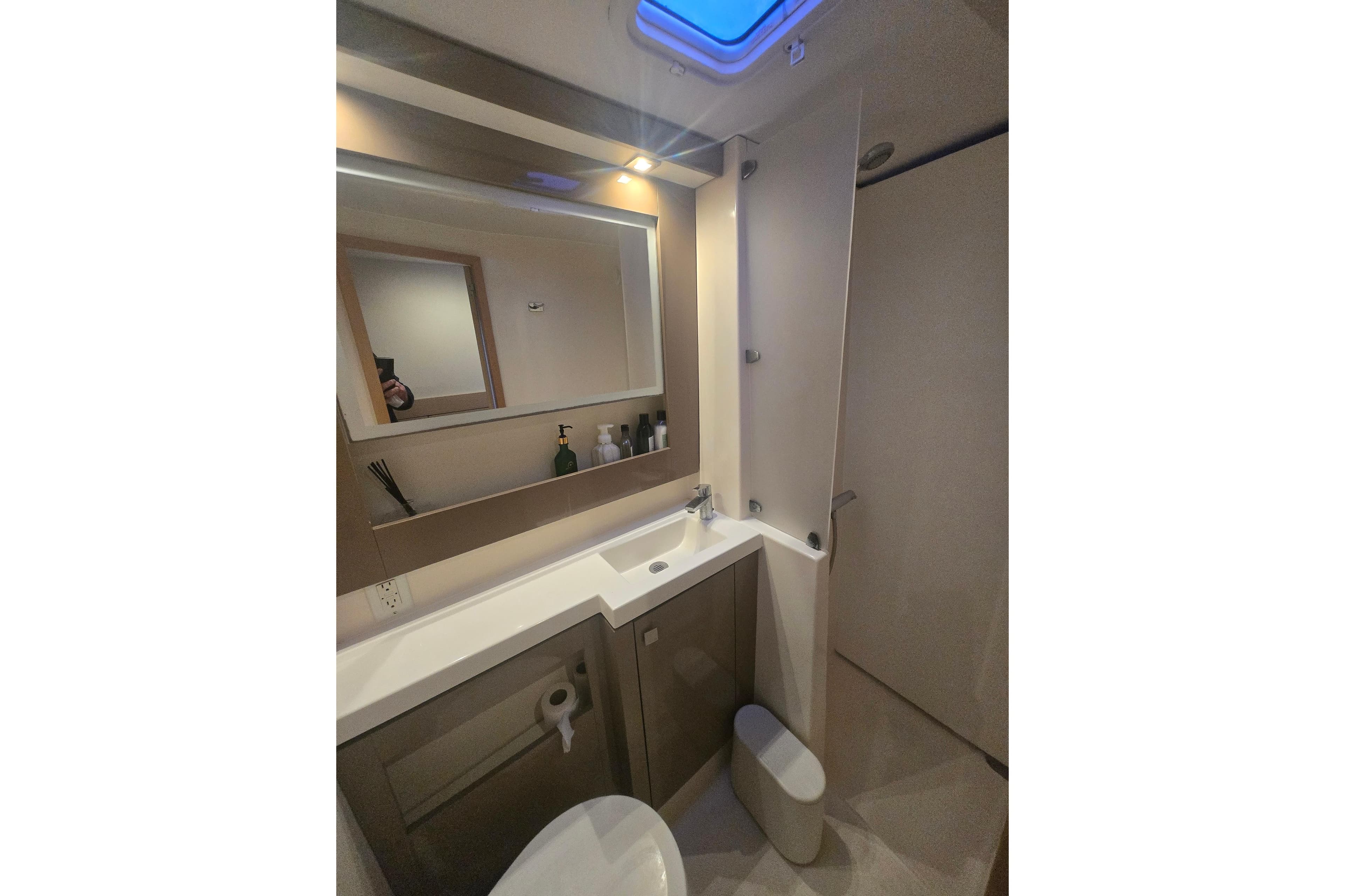 Bathroom interior of 2018 Fountaine Pajot Helia 44 Evolution yacht, featuring modern fixtures.