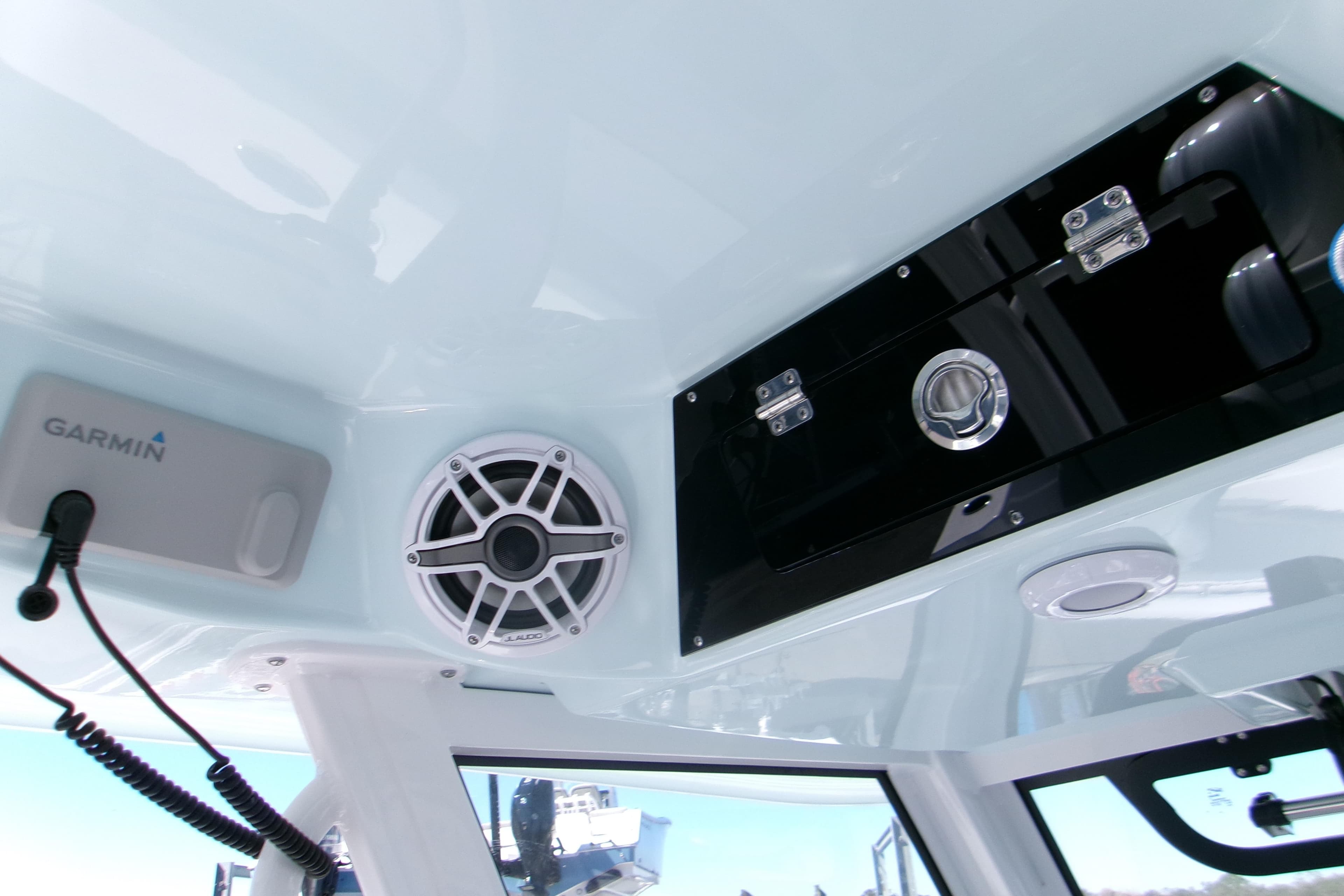 Interior of 2026 Sportsman Heritage 321 Center Console with Garmin equipment and speaker.