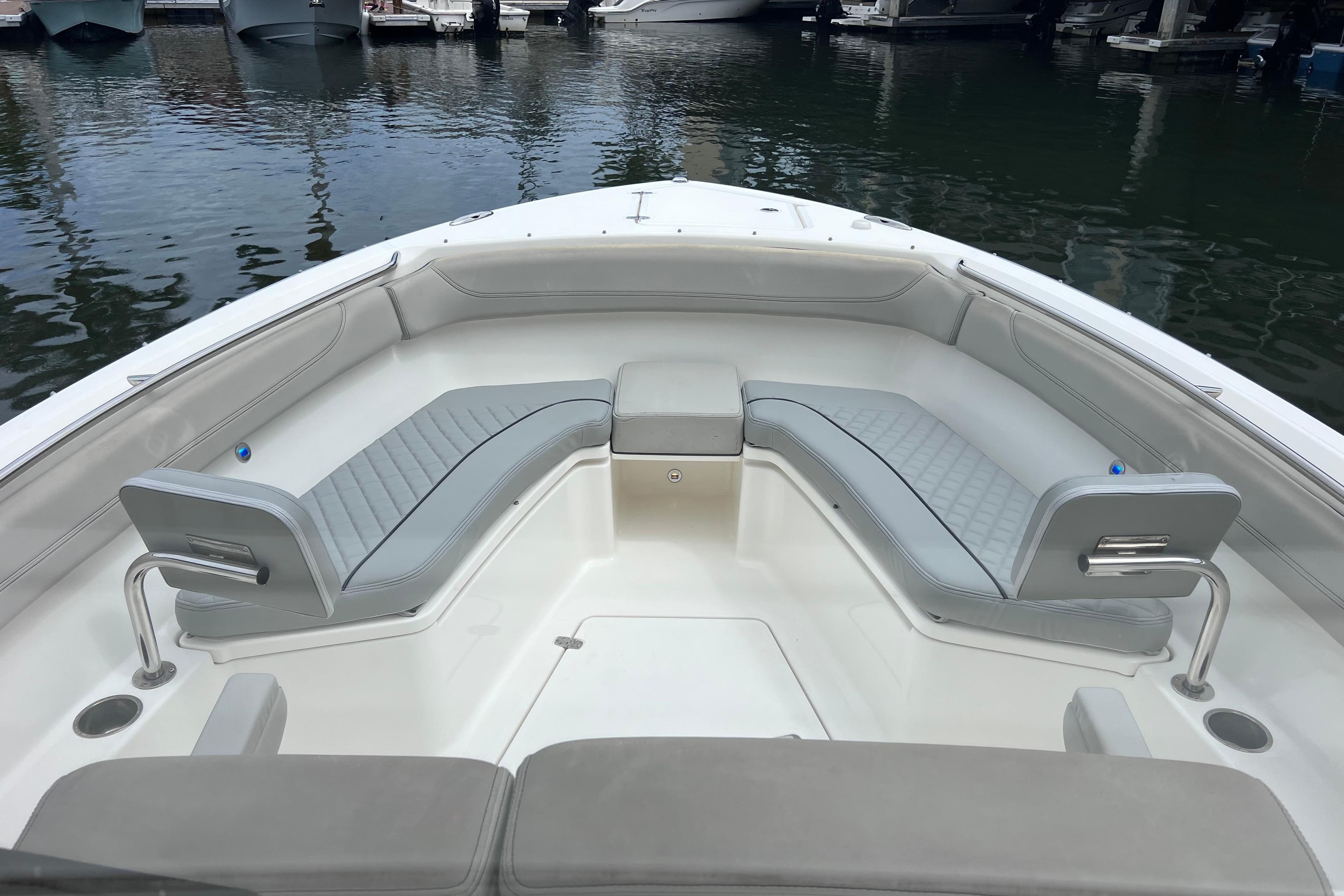 2022 Pursuit S 288 Sport boat interior with cushioned seating at the bow.
