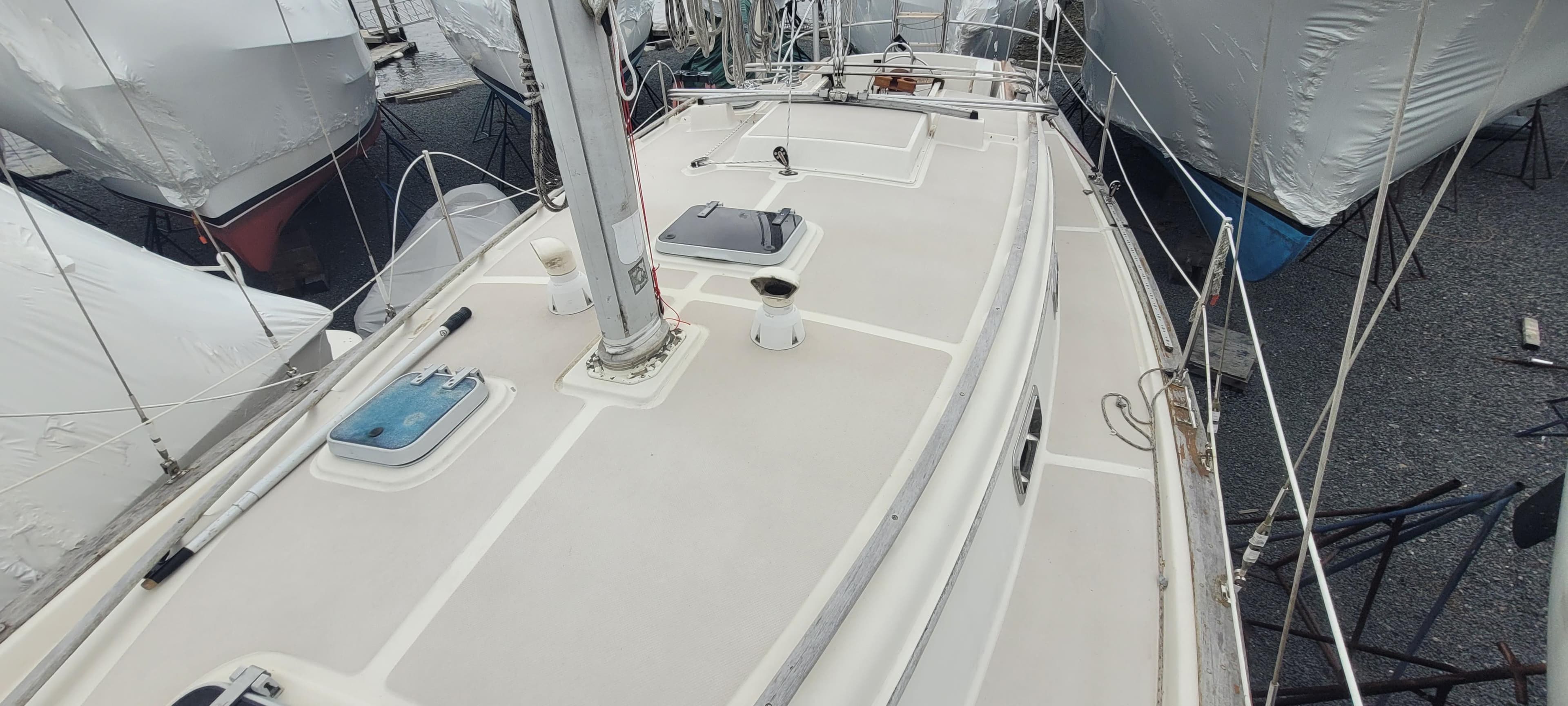 Deck of a 1987 Island Packet 31 sailboat in harbor.