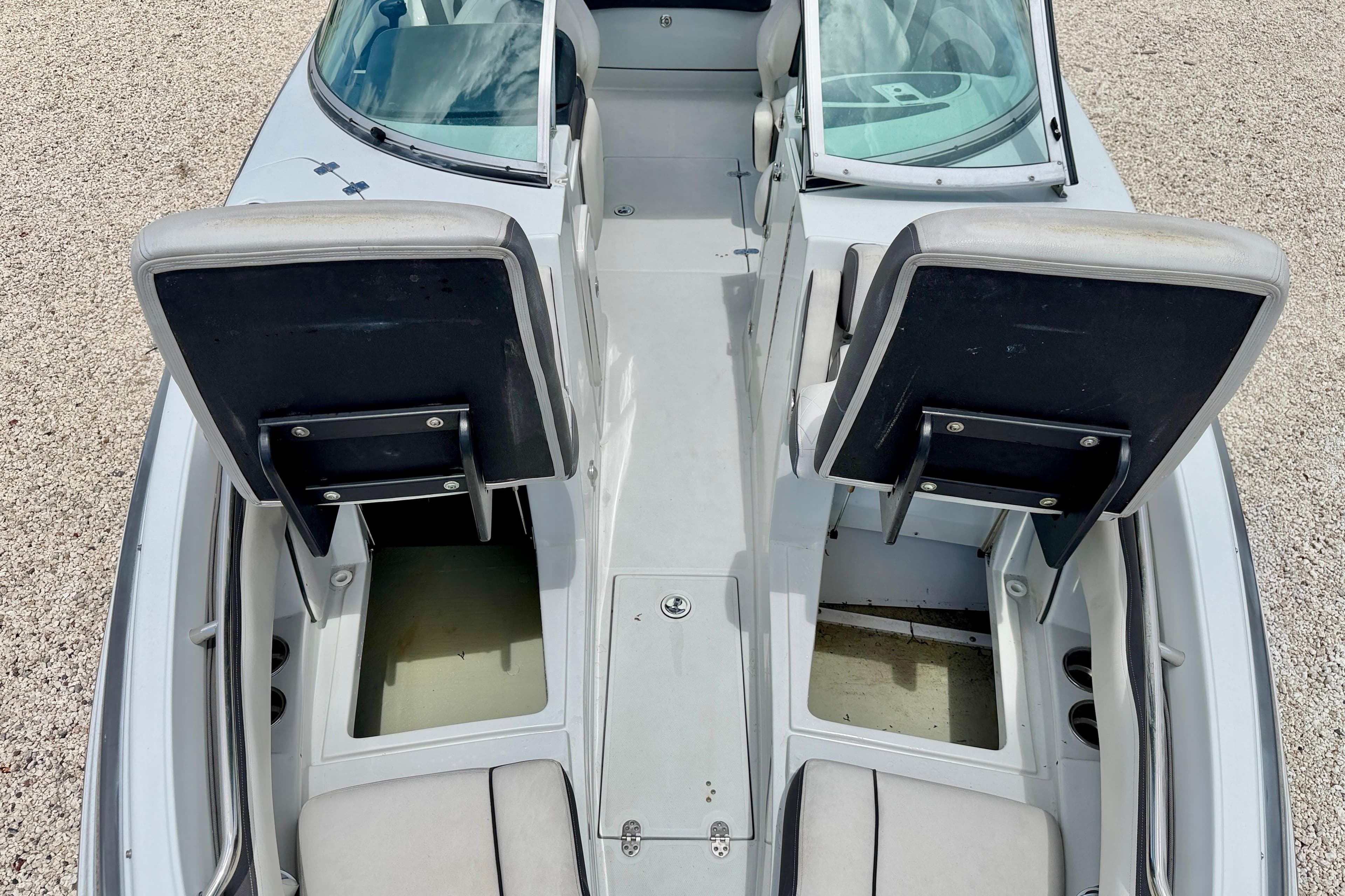 2022 Crownline 260 XSS boat interior with open storage compartments and seating.