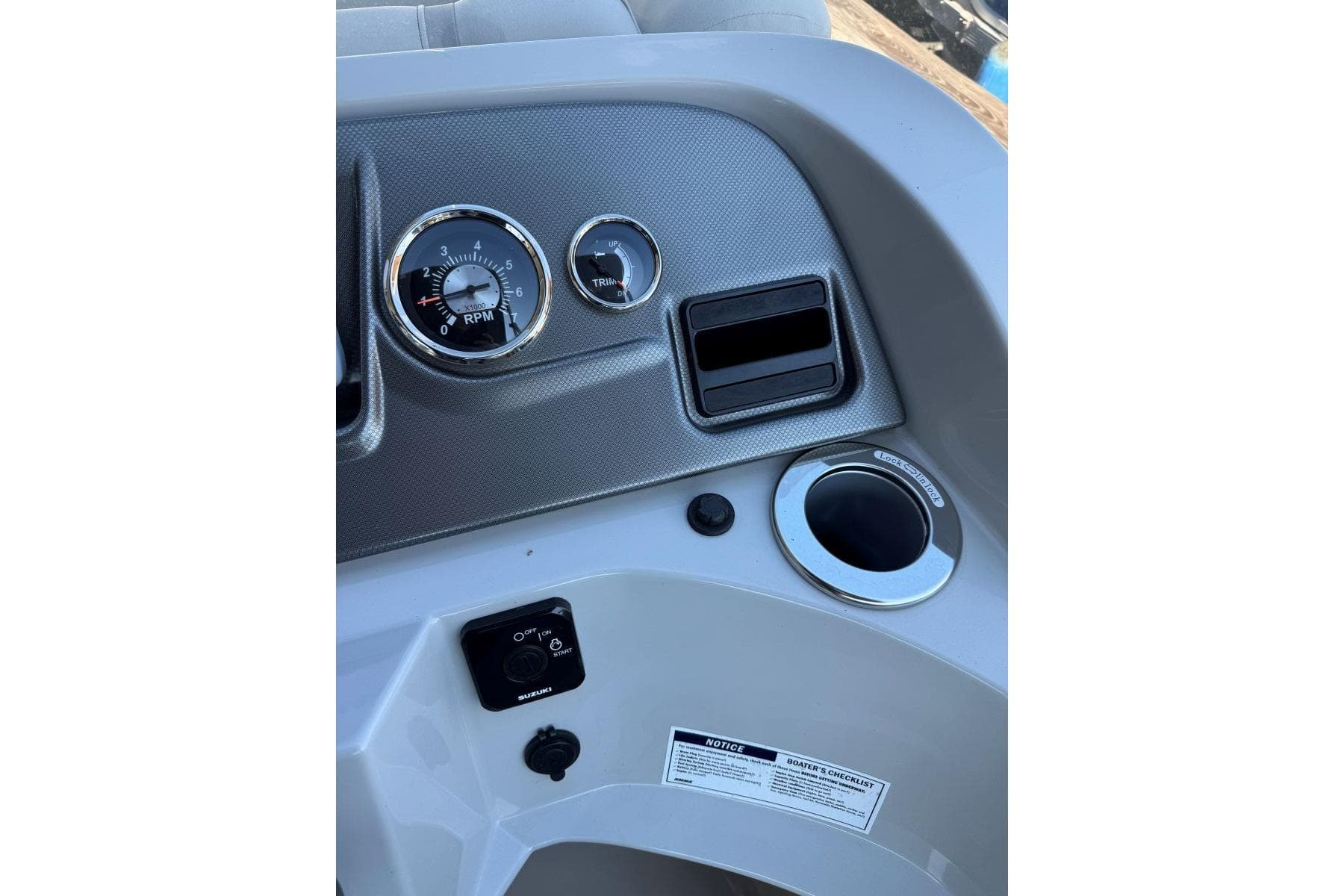 2024 Crest Classic LX 220 SLRC dashboard with RPM gauge and controls.