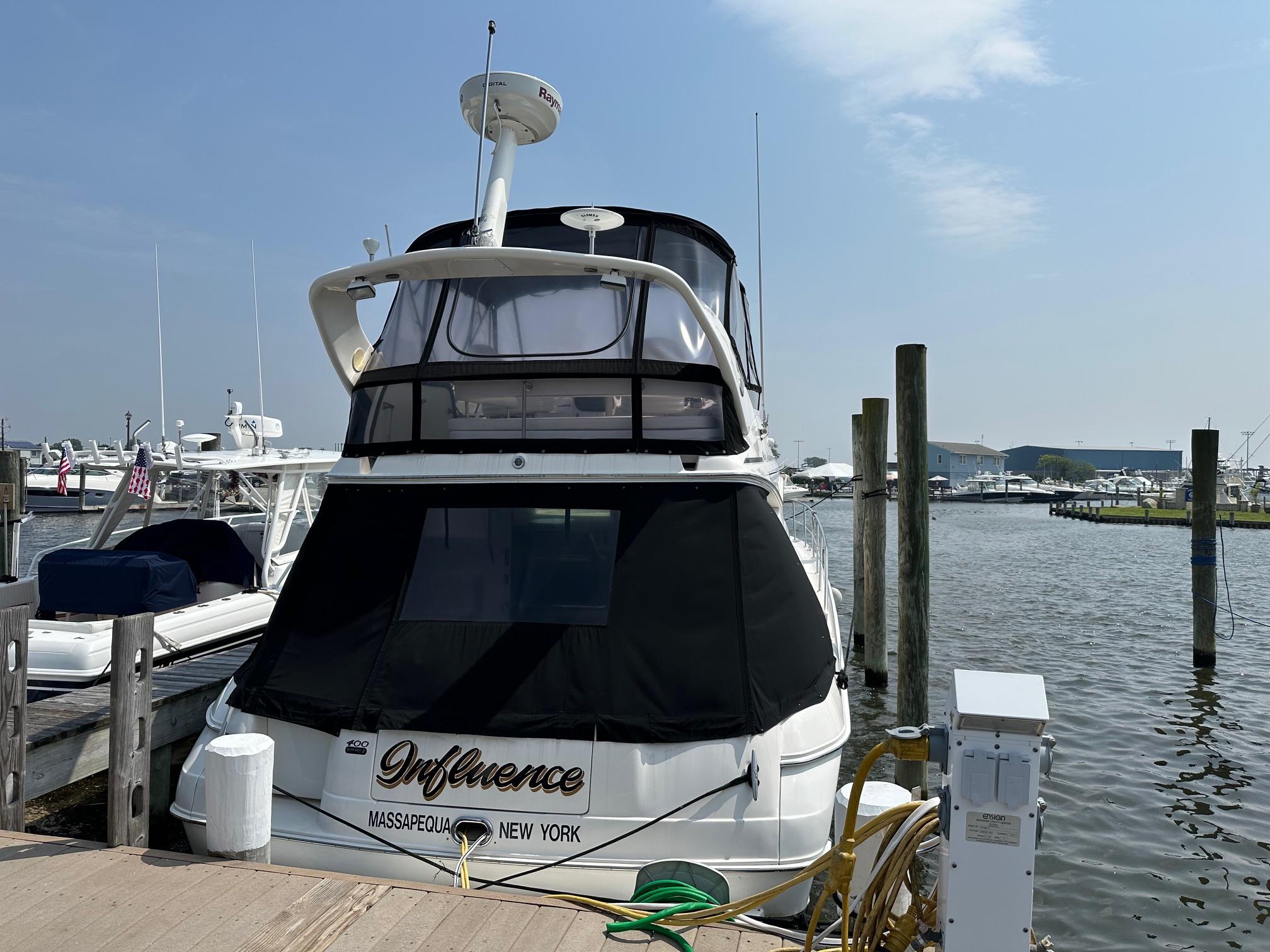 2002 Sea Ray 400 Sedan Bridge docked in Massapequa, New York marina.