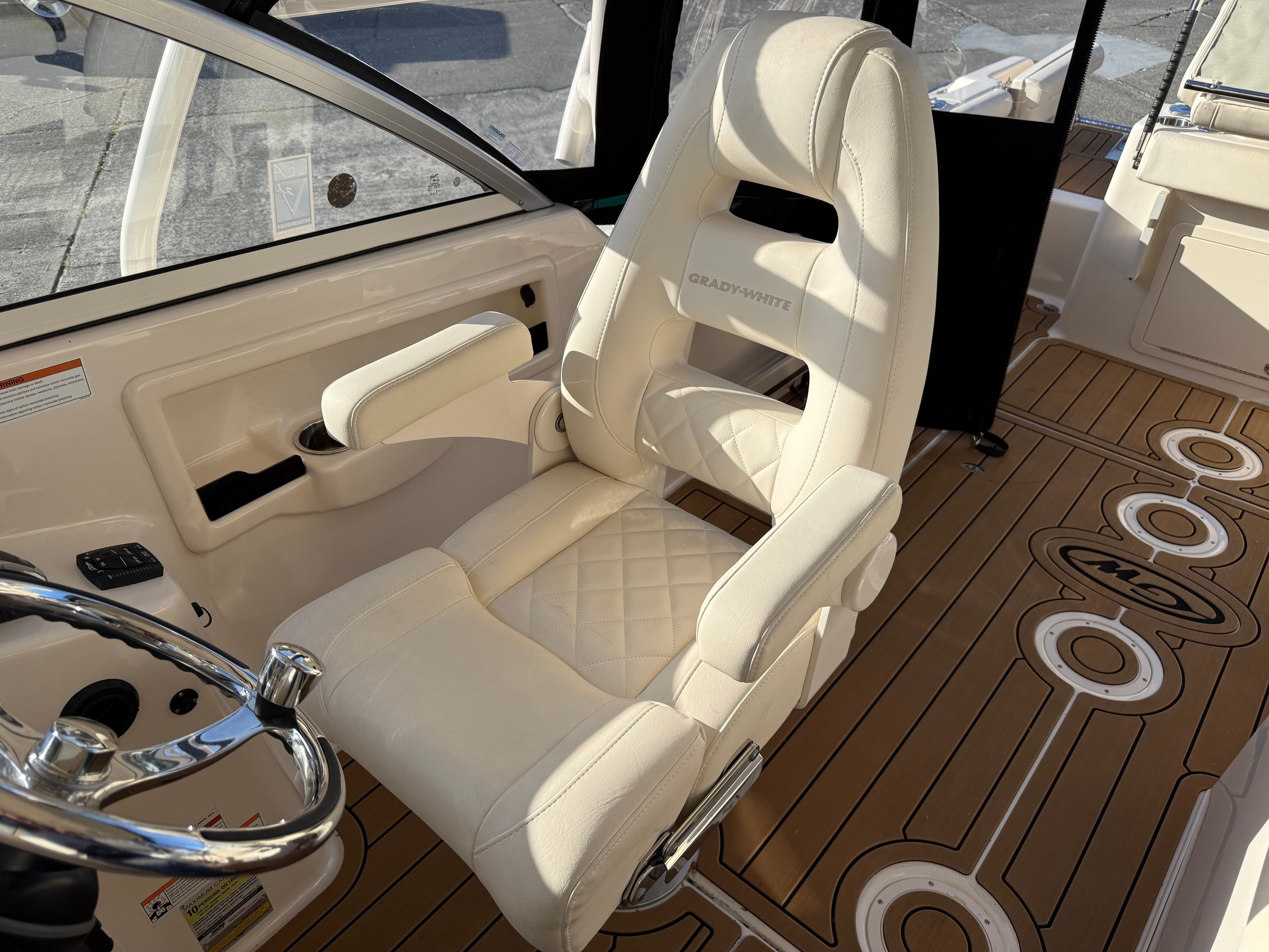 Interior of a 2023 Grady-White Freedom 255 boat with luxurious seating.