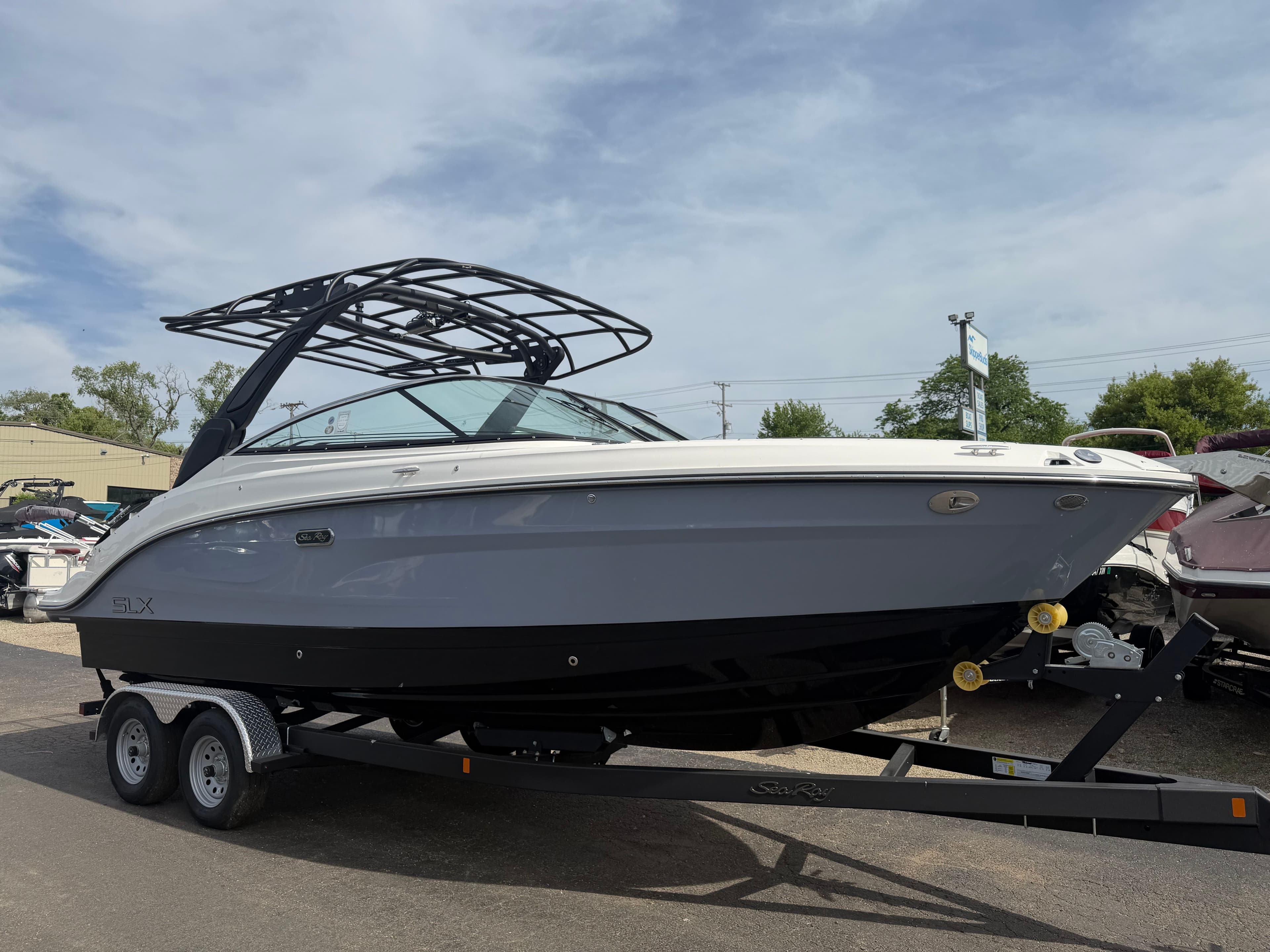 2026 Sea Ray SLX 260 boat on trailer outdoors.