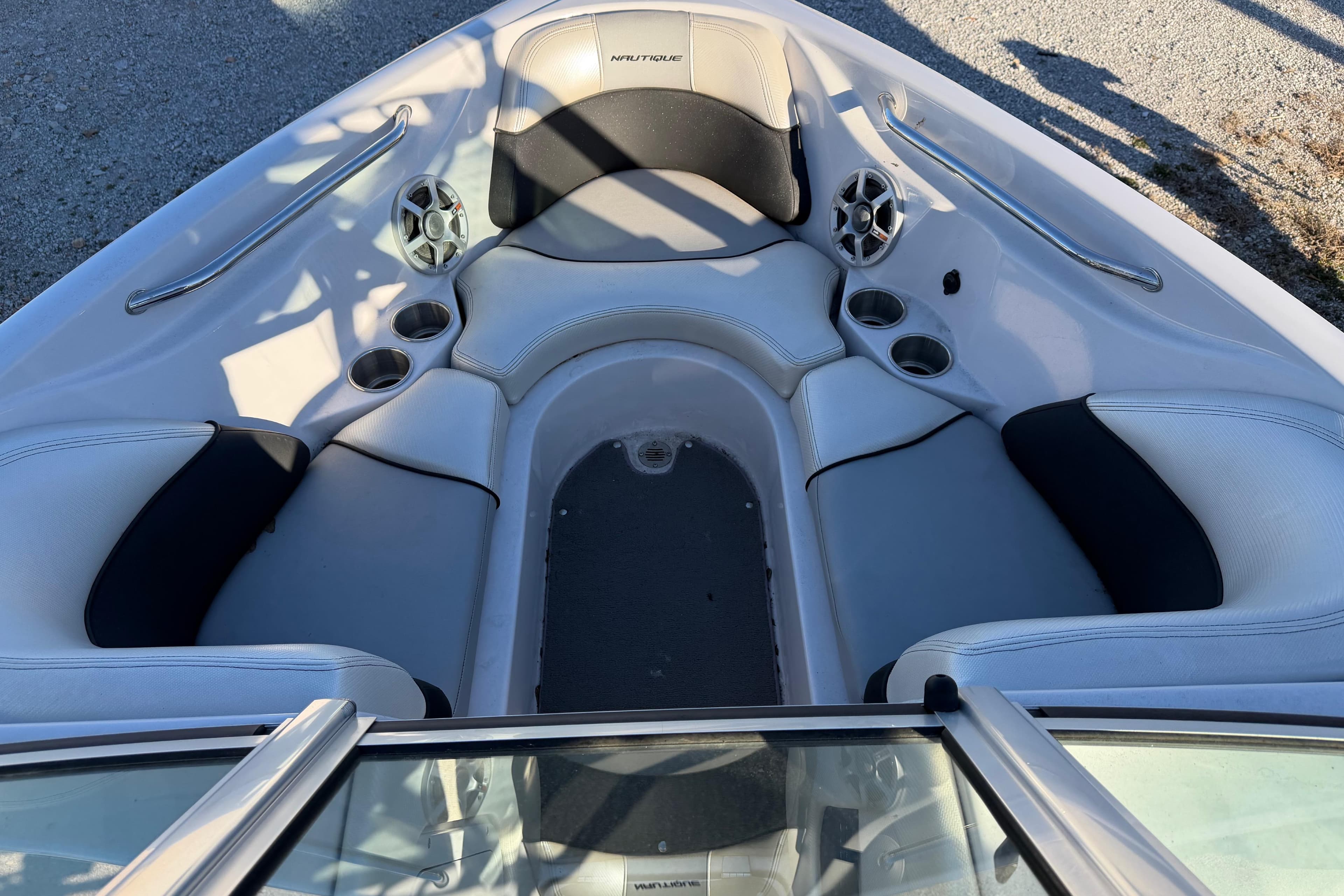 2008 Nautique Super Air Nautique 220 boat interior with seating and cup holders.