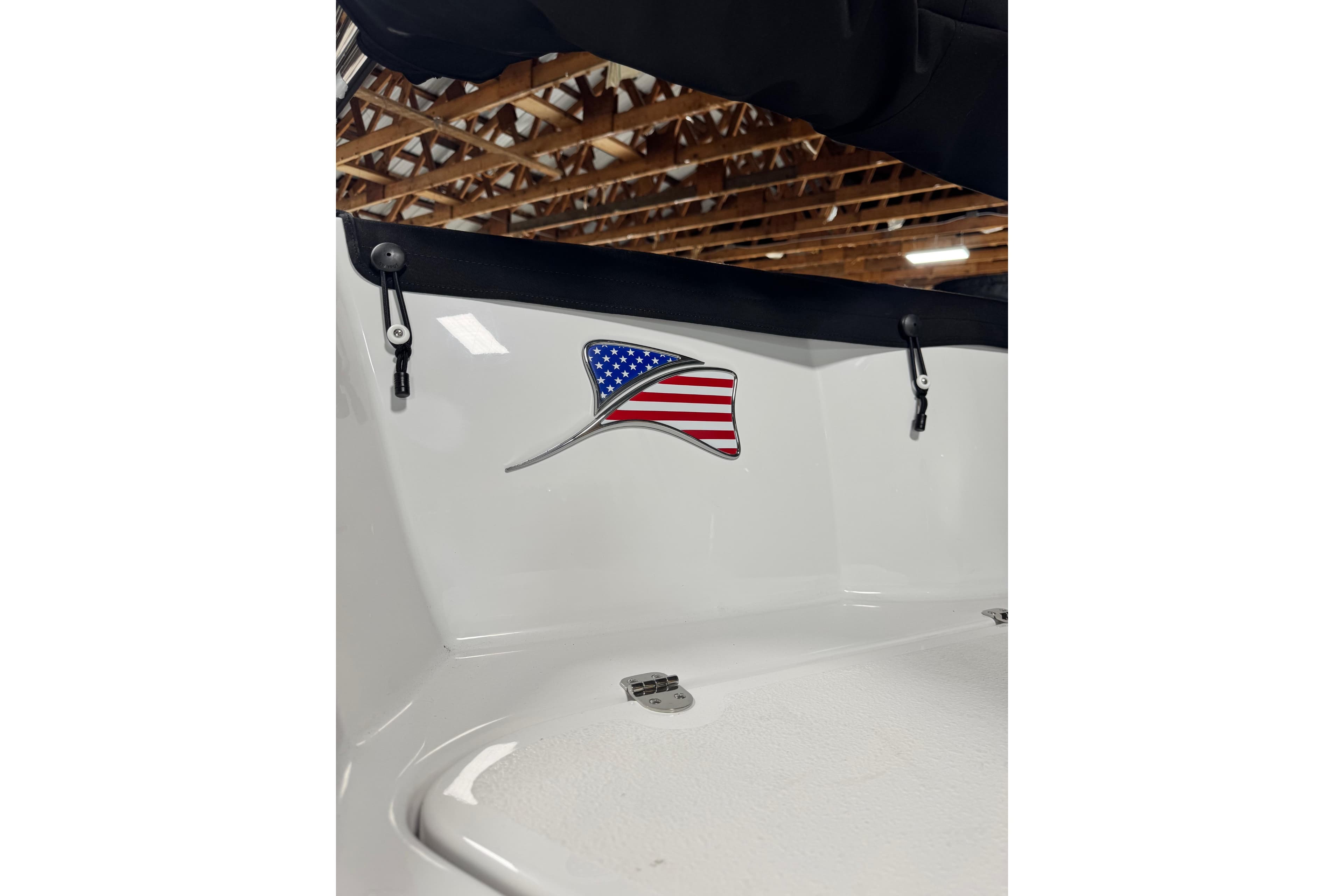 2026 Stingray 211 DC boat interior with American flag emblem.