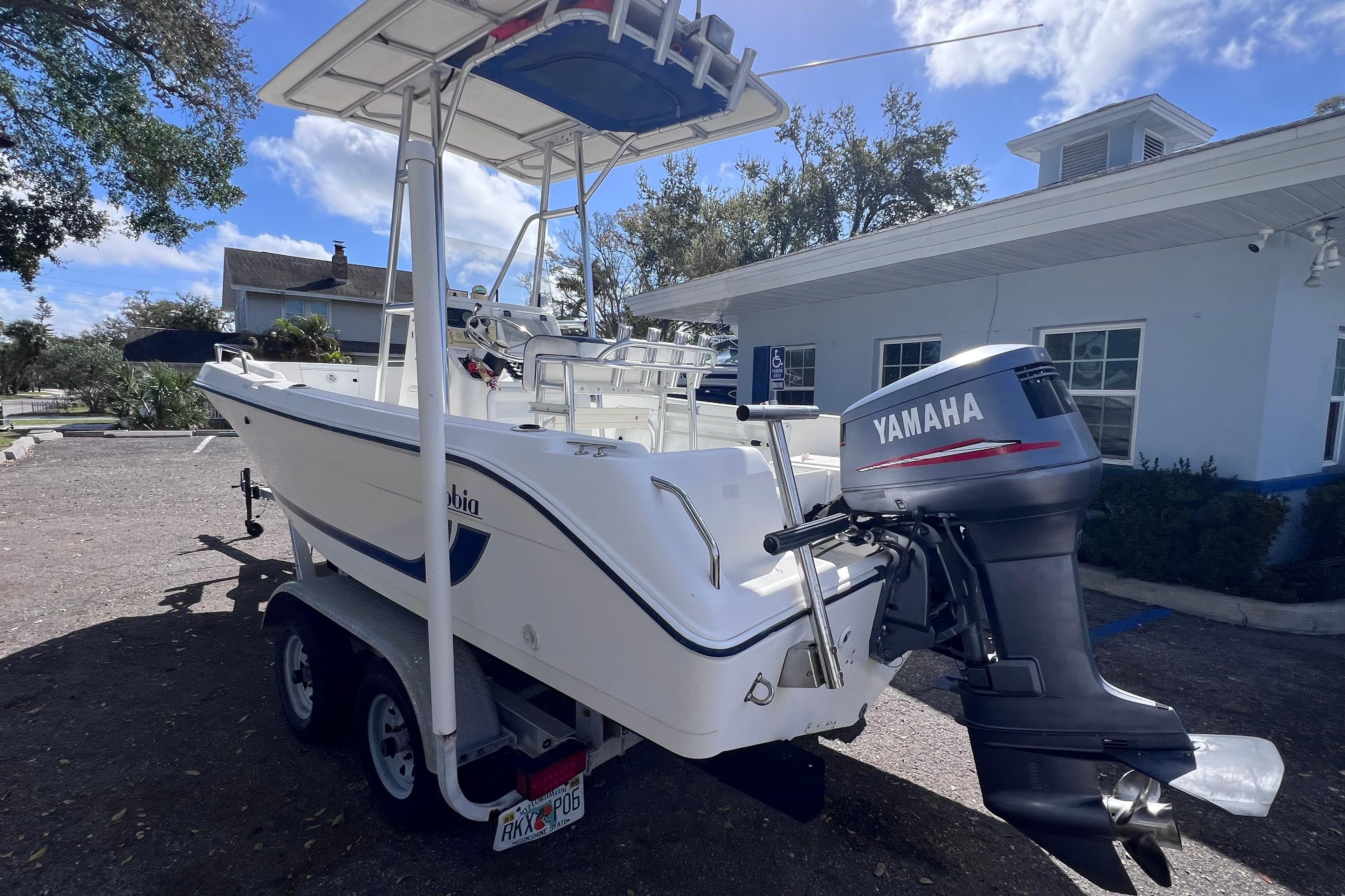 2001 Cobia 194 Center Console boat with Yamaha outboard motor on trailer.