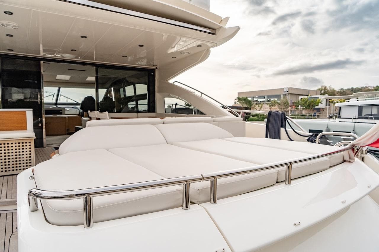 Luxurious 2012 Princess V72 yacht with spacious deck and elegant seating area.