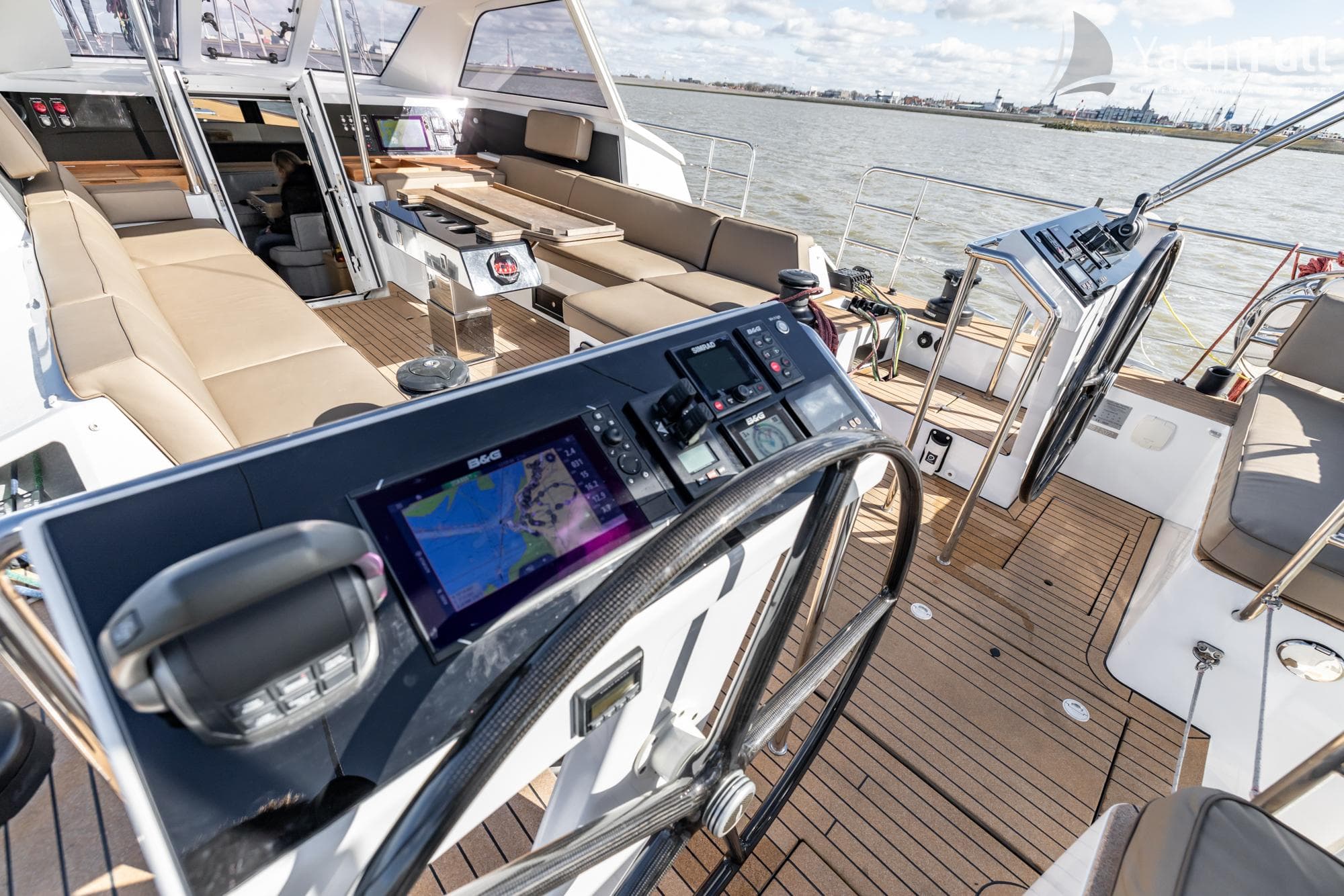 Luxurious 2022 Garcia Exploration 60 yacht cockpit with navigation system and spacious seating.