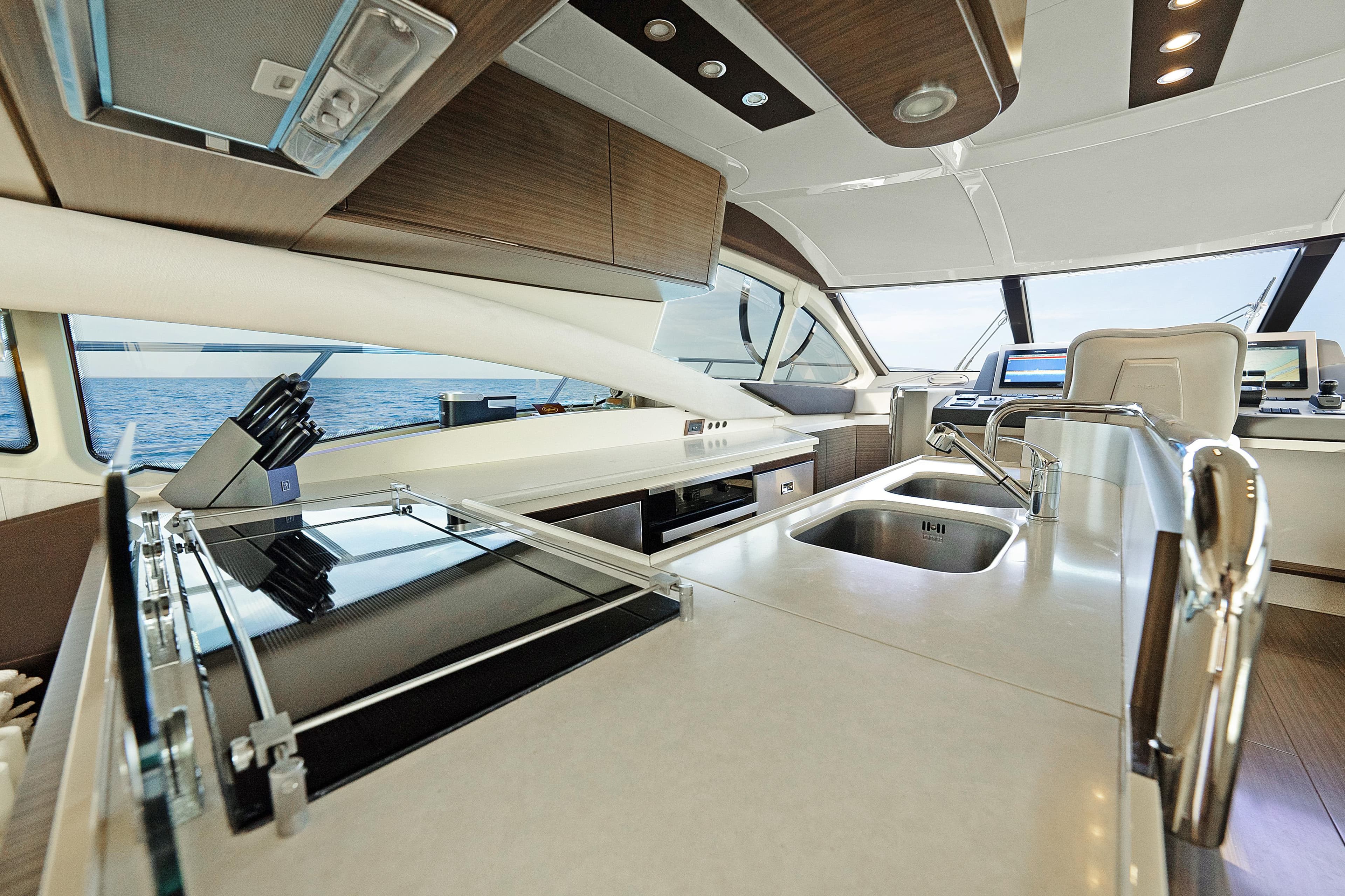Luxurious interior of 2017 Azimut 60 Flybridge yacht with modern kitchen amenities.