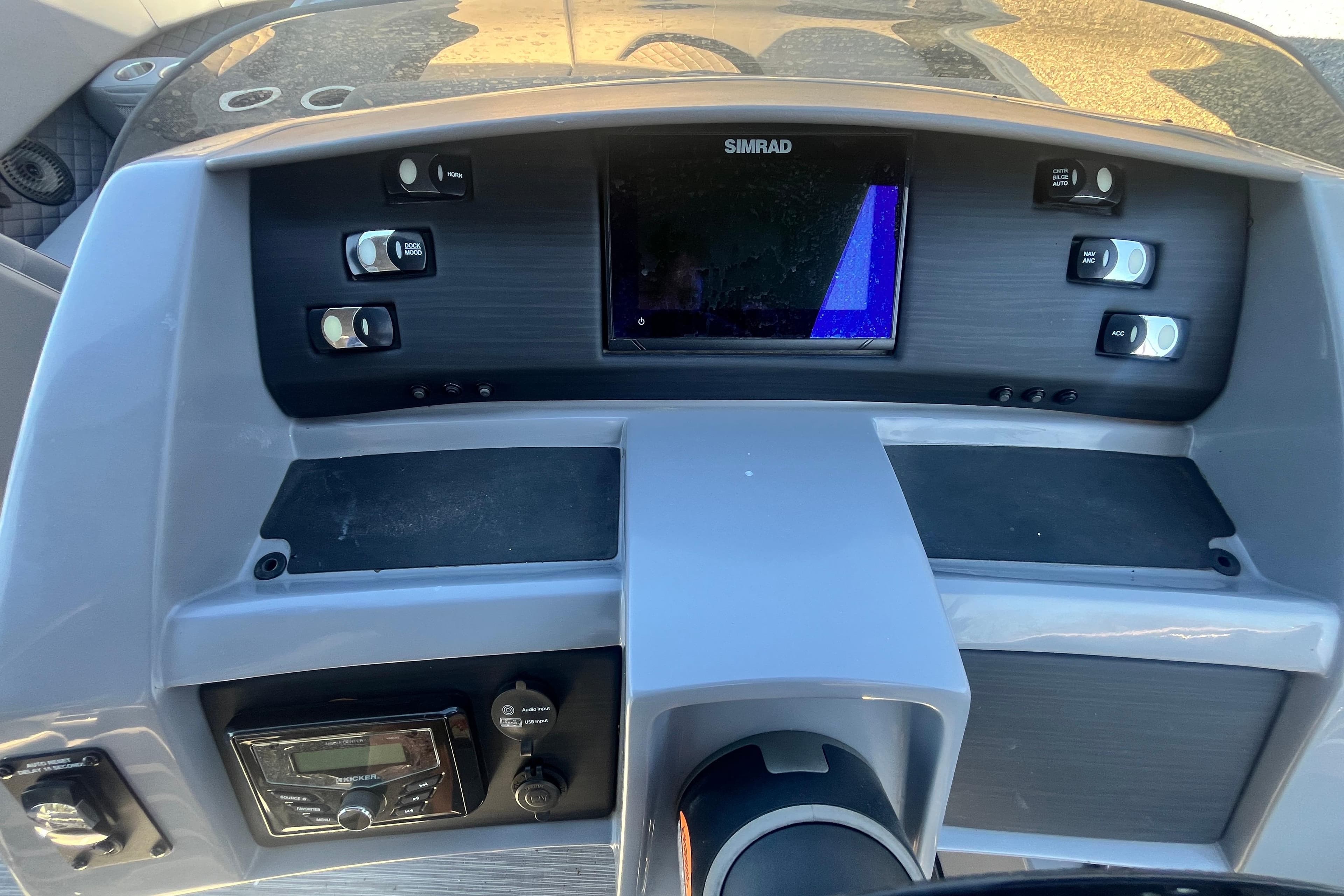 Dashboard of 2022 Bennington 23LT boat with Simrad display and controls.