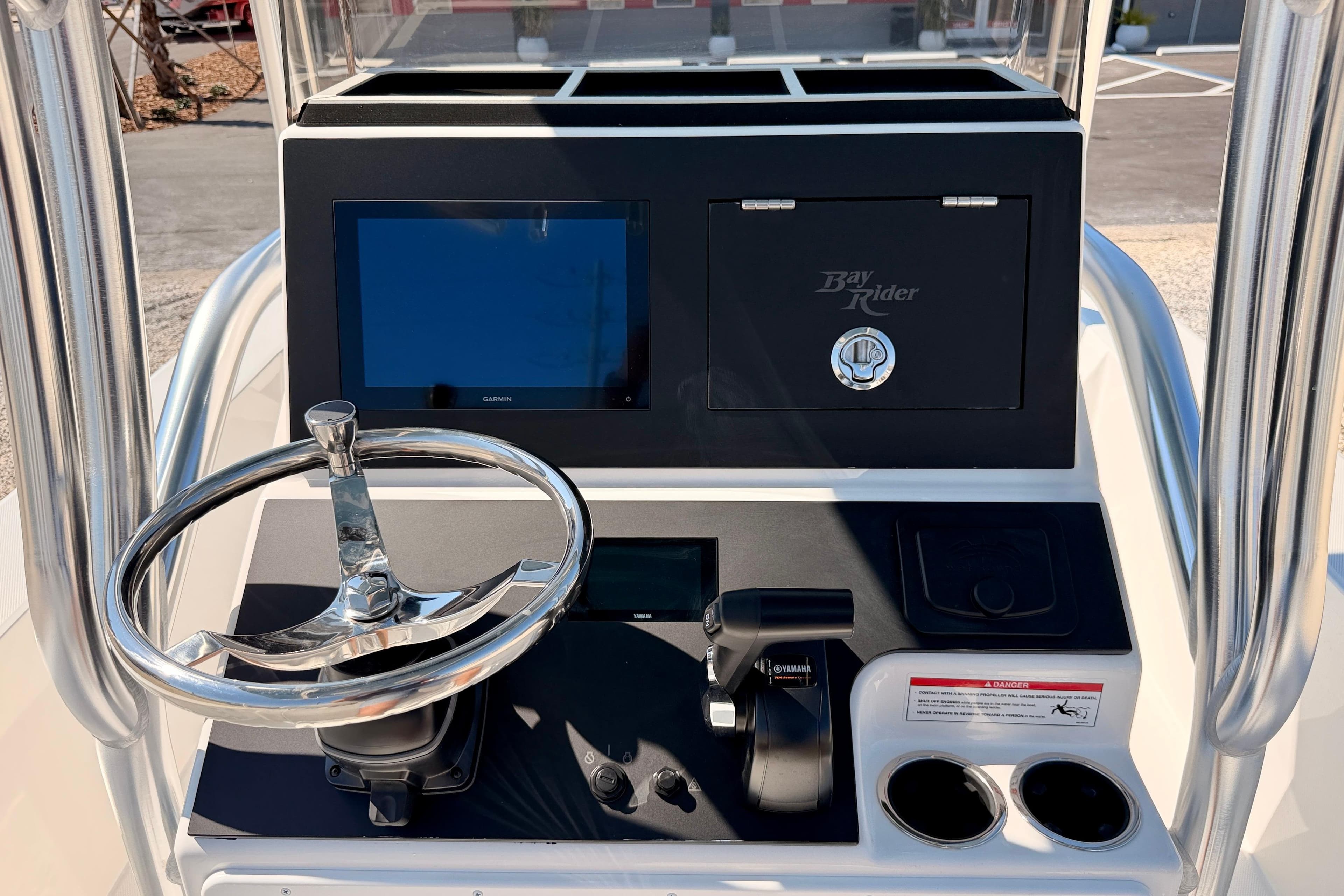 2026 Bay Rider 2460 FS Skiff console with steering wheel and navigation display.