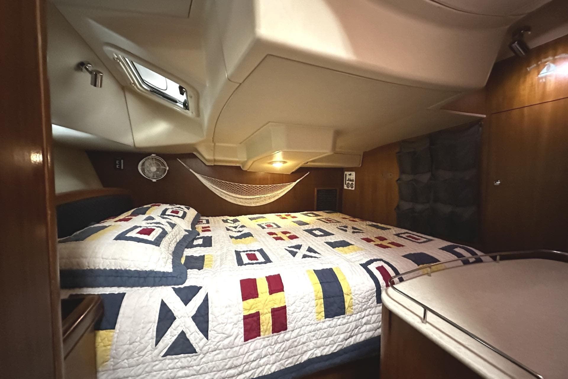 Interior of a 2004 Hunter 41 Aft Cockpit yacht with cozy bed.