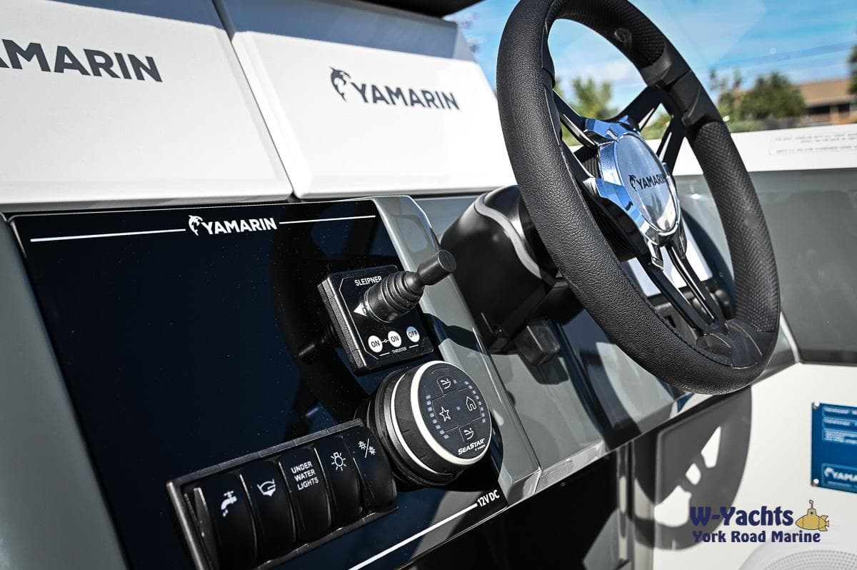 Control panel and steering wheel of the 2024 Yamarin 80 boat.