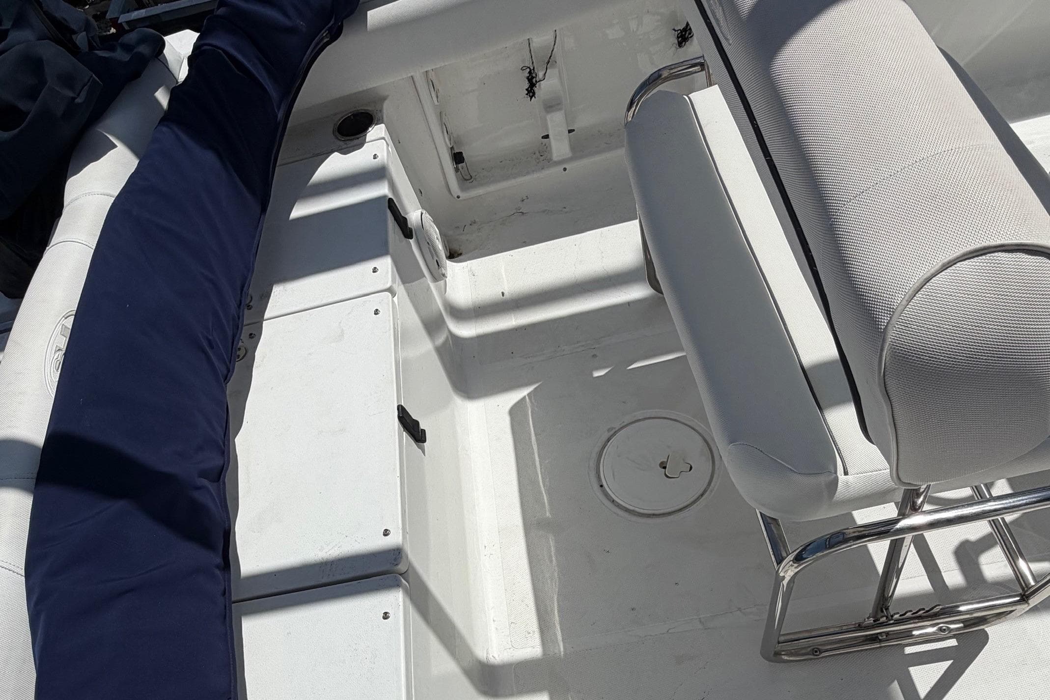 2016 Sea Hunt Ultra 196 boat interior with cushioned seating and storage compartments.