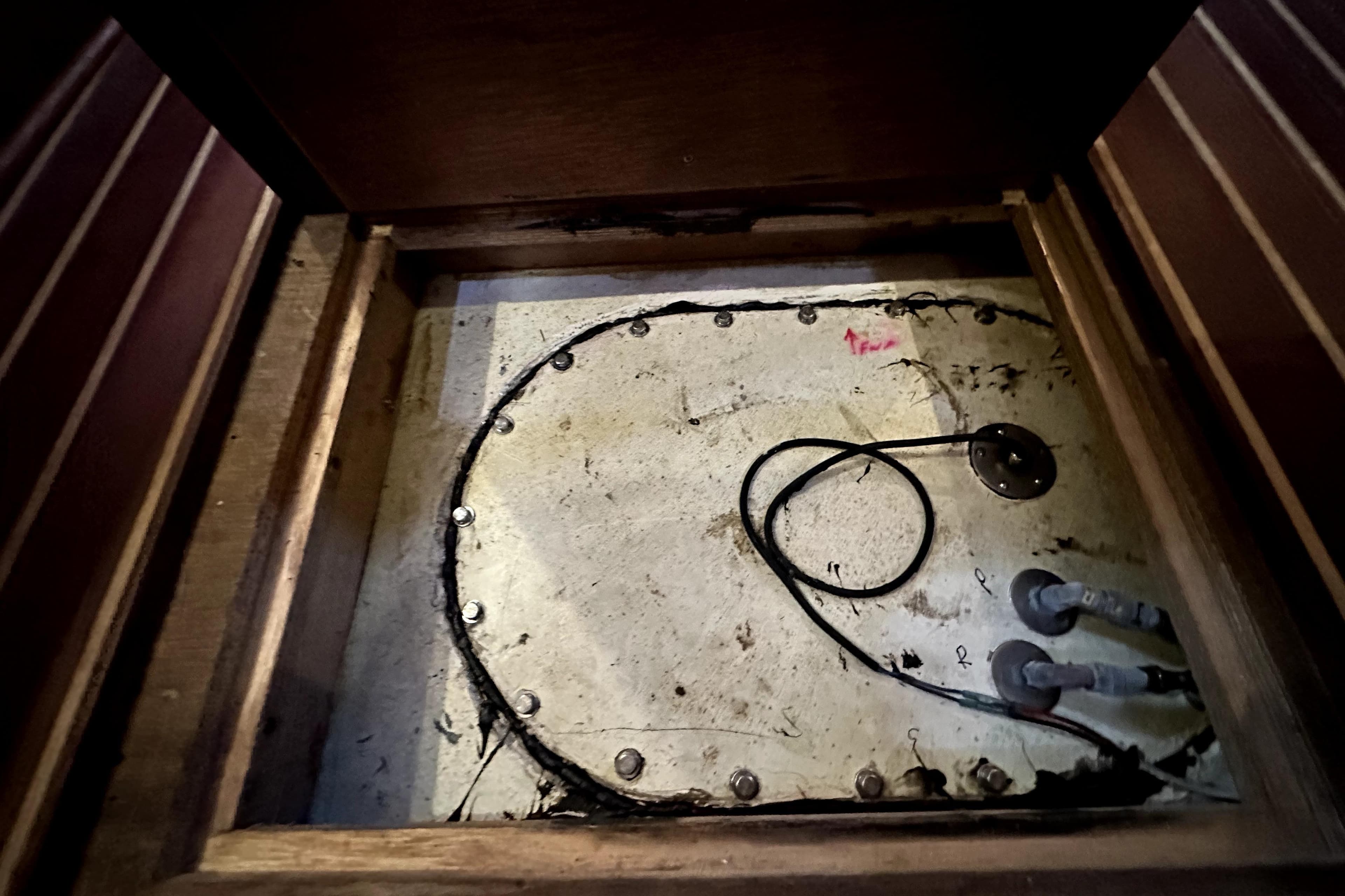 Access panel of a 2012 Custom Pacific Northwest 43 boat, showing wiring and components.