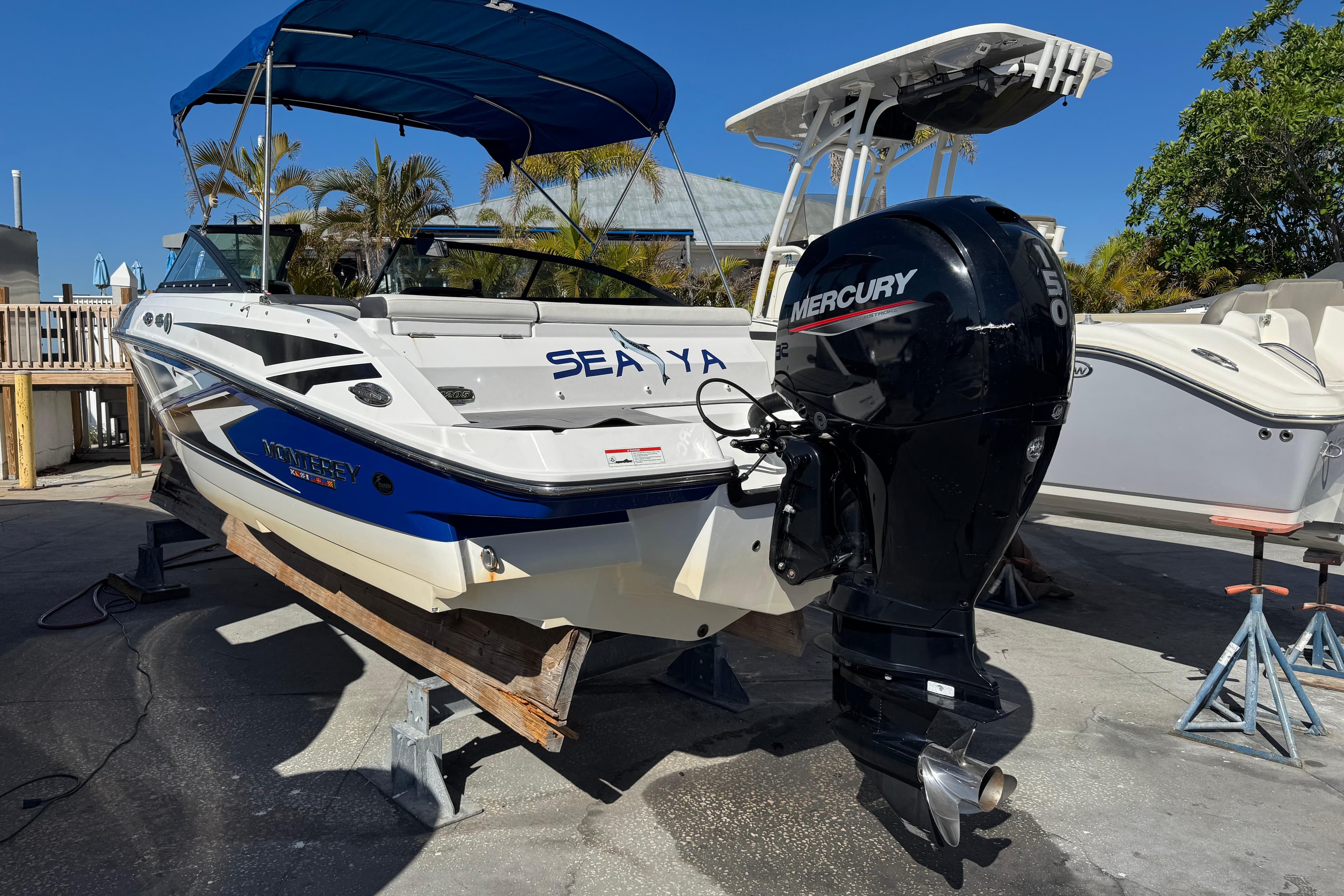 2020 Monterey M-205 boat with Mercury outboard motor on display.