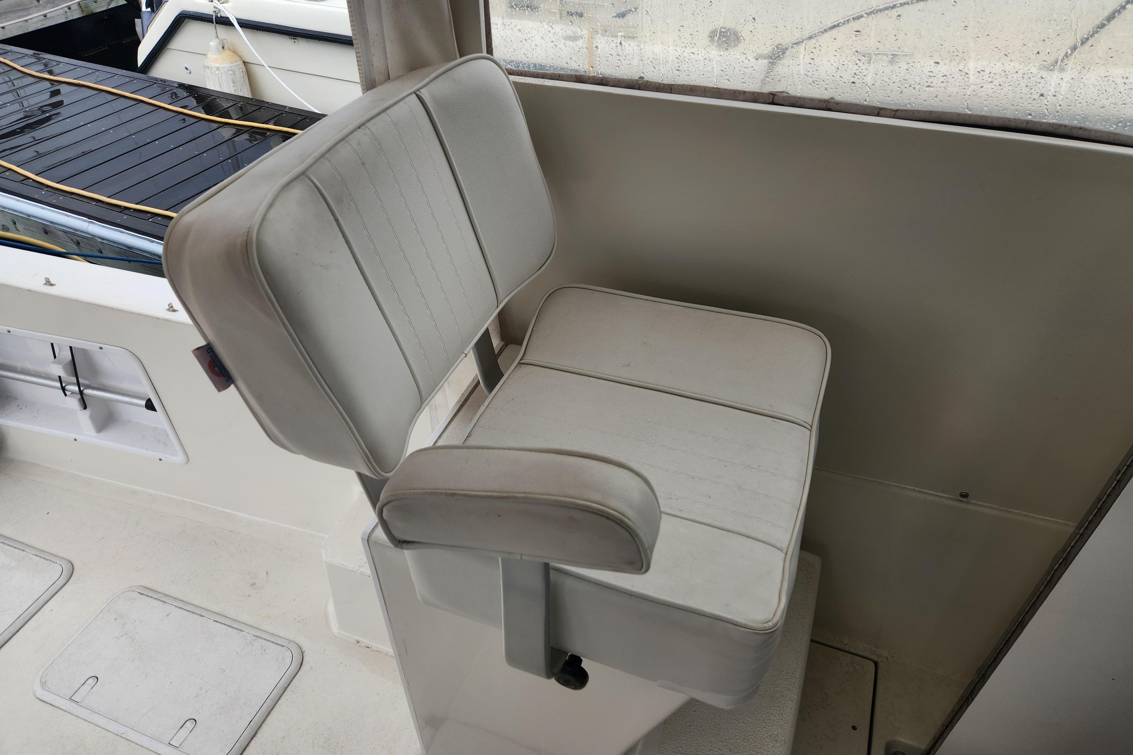 White boat seat on 2018 Atlas Acadia, near deck area.