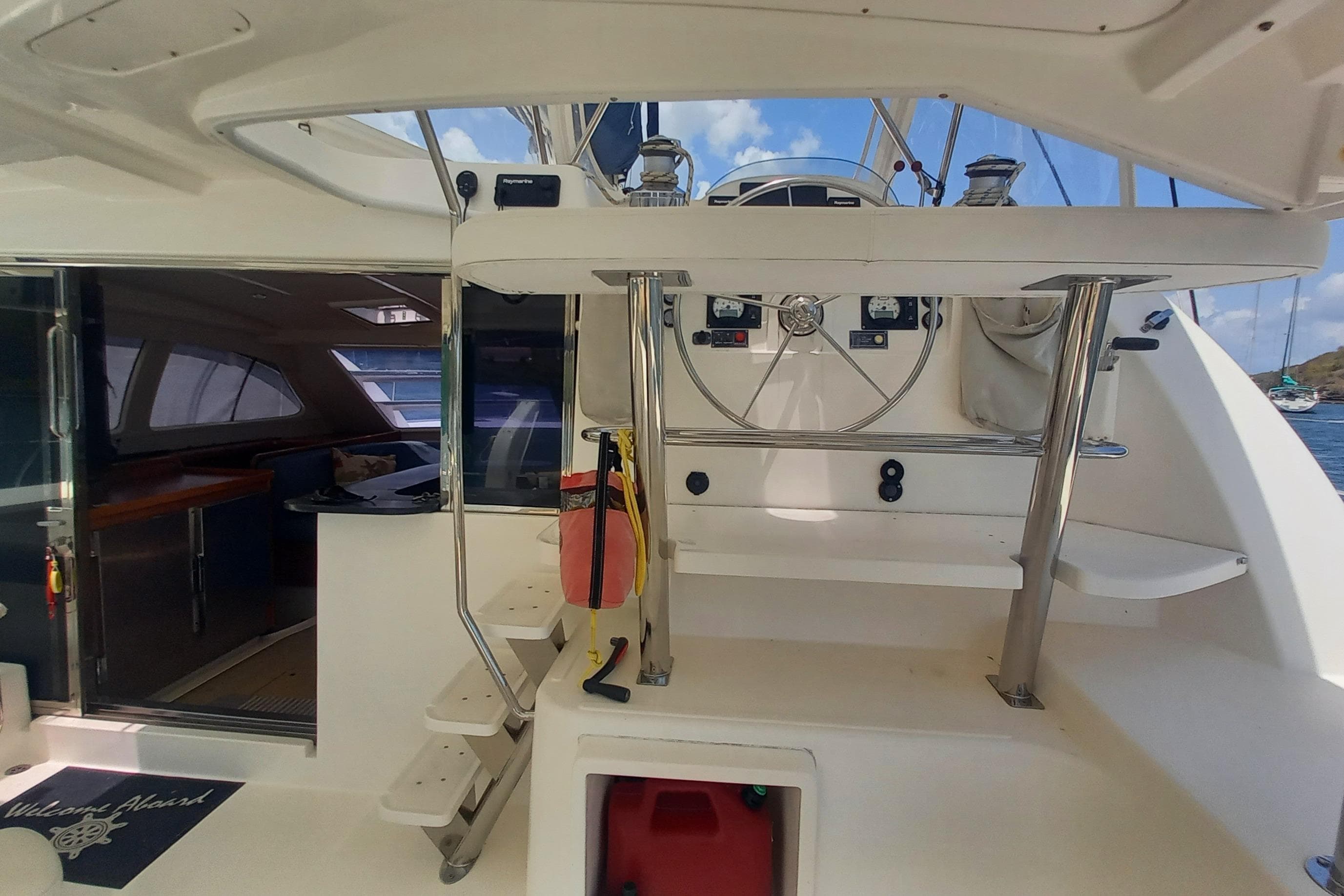Interior view of a 2010 Leopard 46 yacht, featuring helm and cabin entrance.