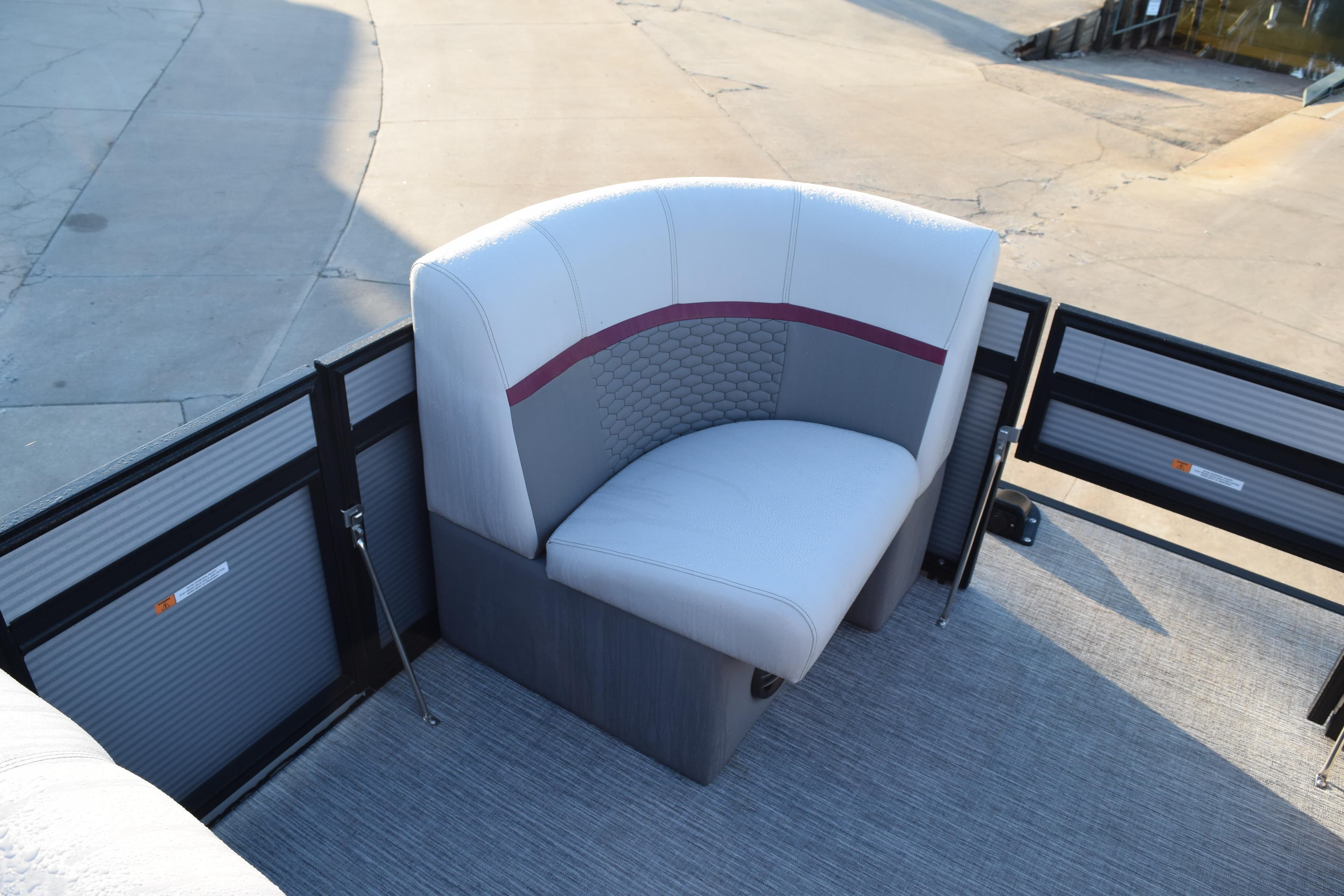 2023 Qwest 818 XRE E Class XRE Fish LT boat seat, gray and white upholstery.