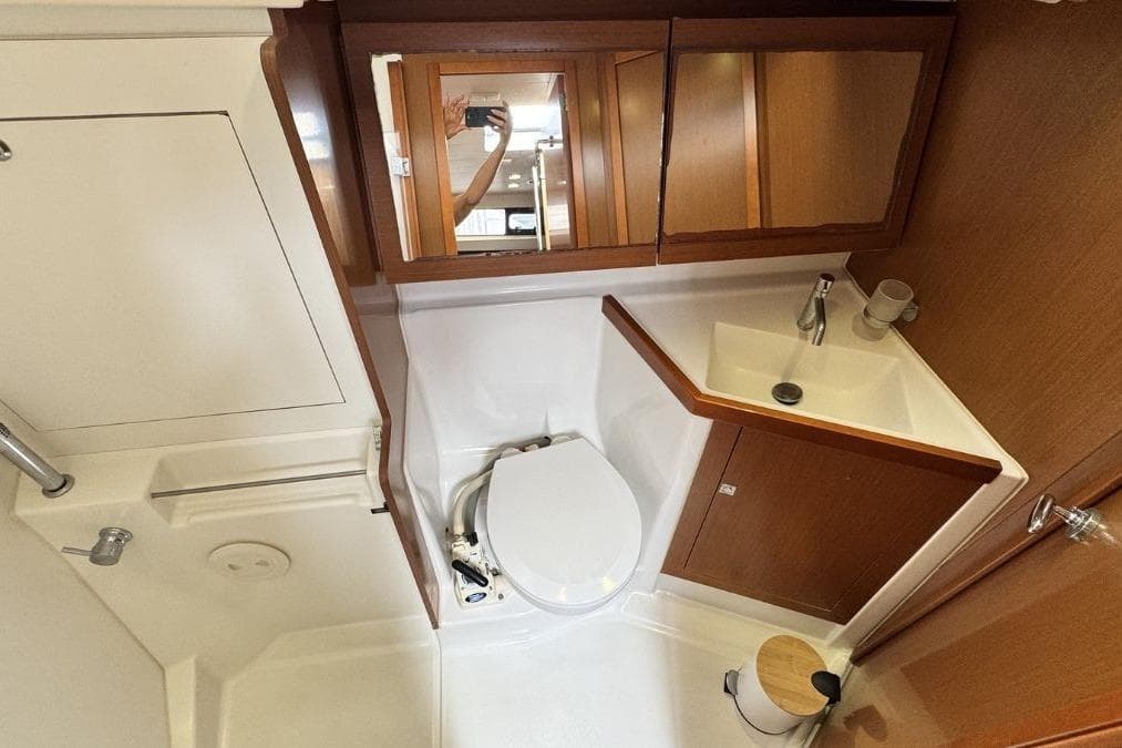 Bathroom interior of 2012 Beneteau Oceanis 41 yacht, featuring sink and toilet.