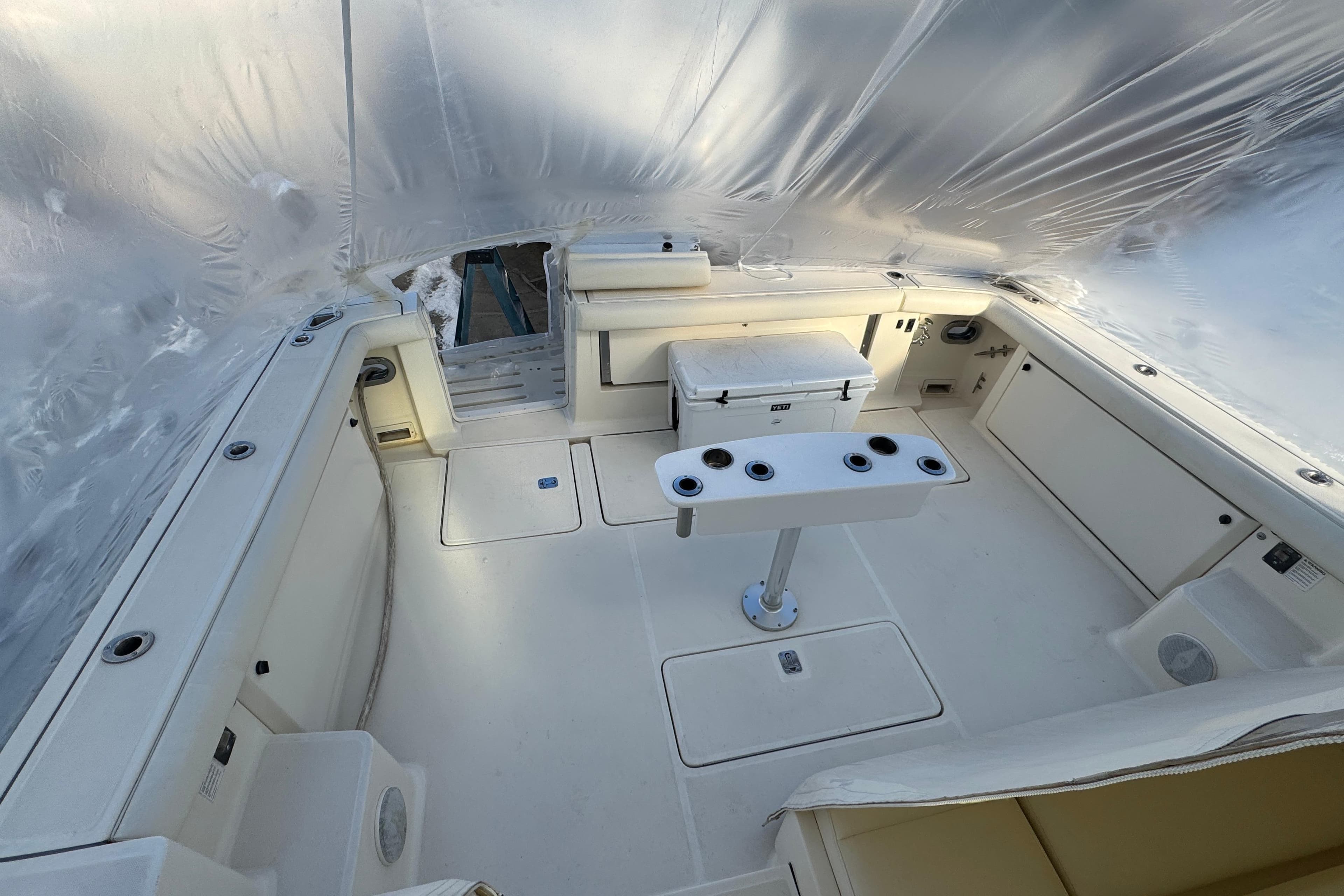 1998 Tiara Yachts 4100 Open cockpit with seating and fishing rod holders.