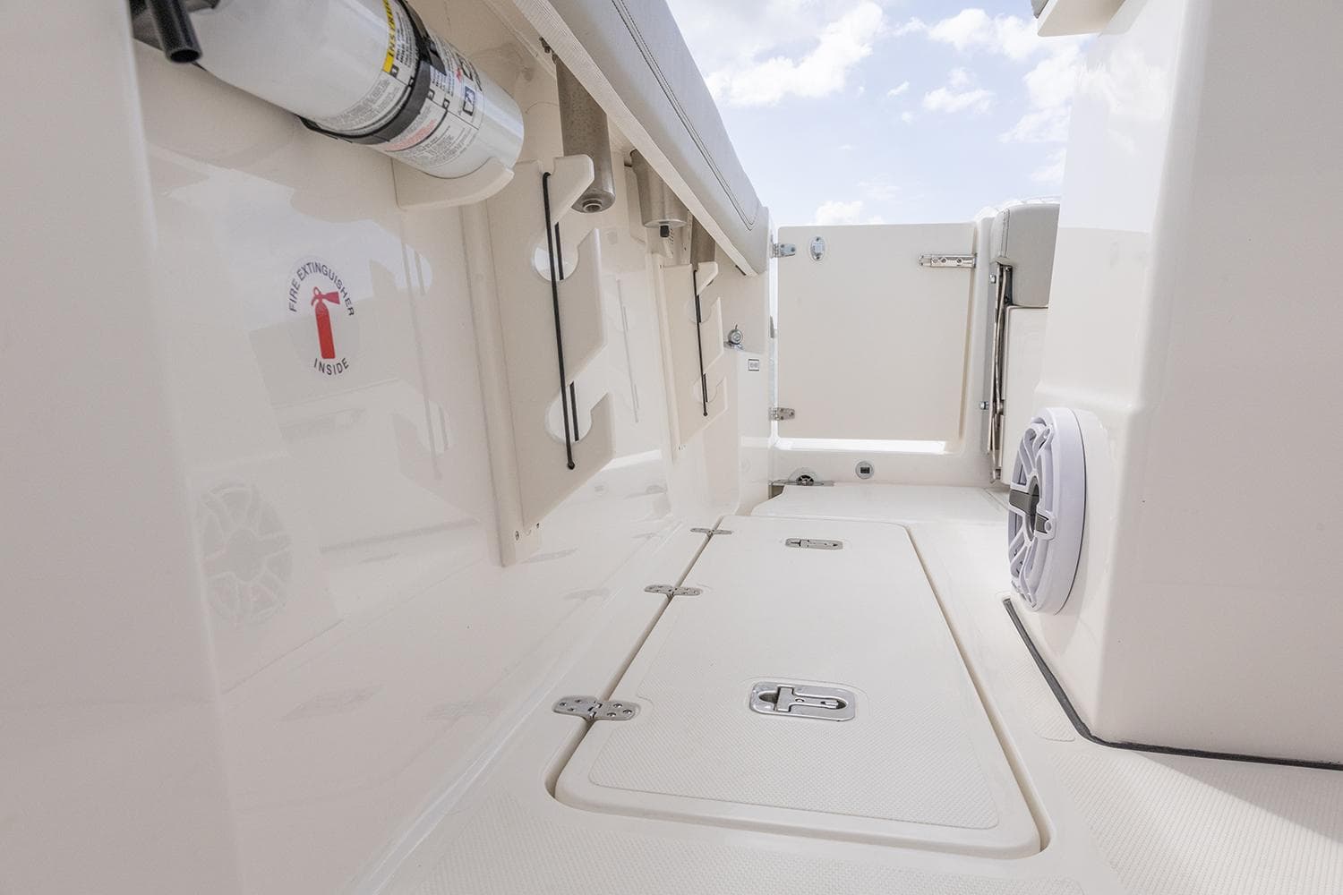 Manufacturer Provided Image: 2025 Pursuit S 248 Sport boat interior, featuring storage compartments and sleek design elements.