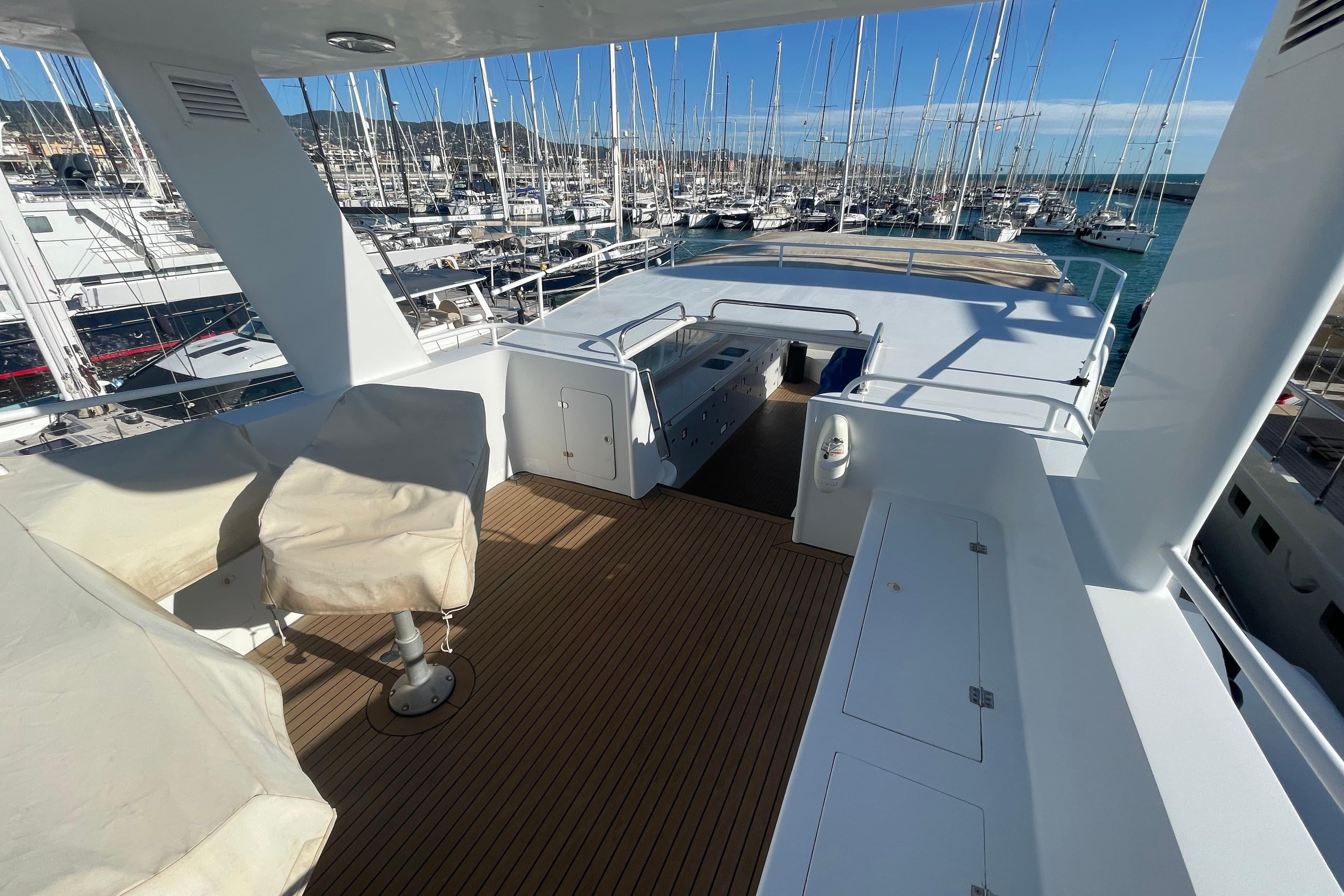 Luxurious 2005 ATB Maroc Custom 28.8 yacht deck with marina view.