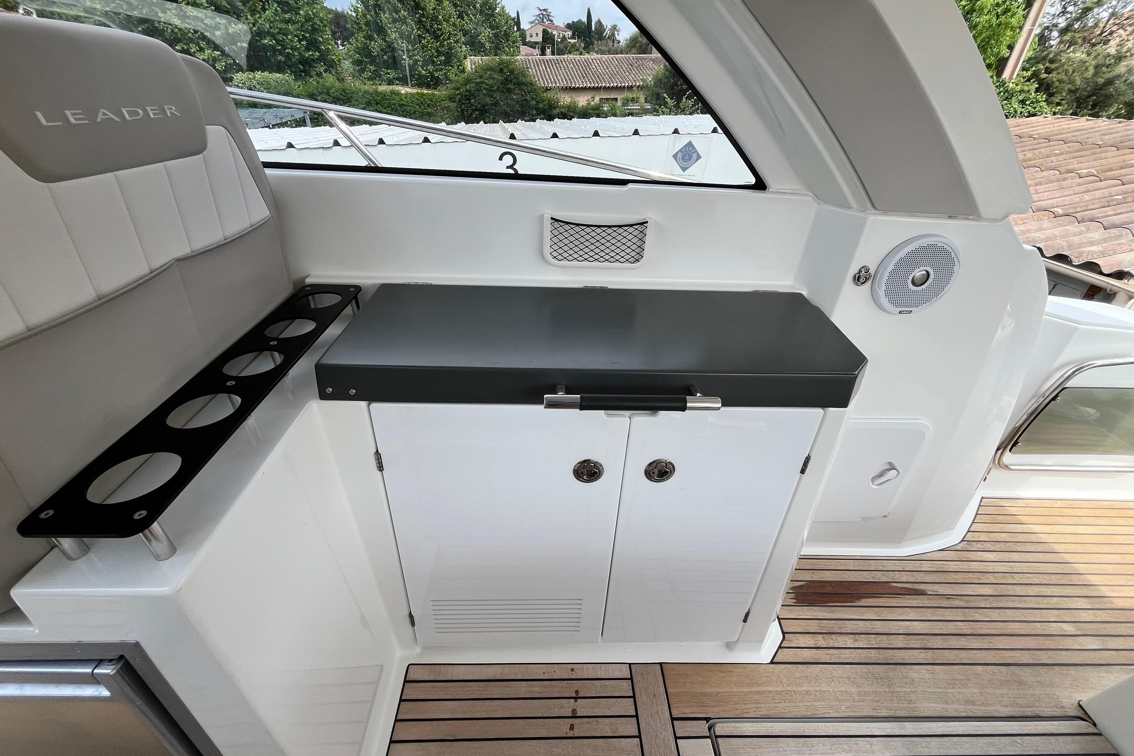 2017 Jeanneau Leader 40 yacht interior with seating, storage, and cup holders.
