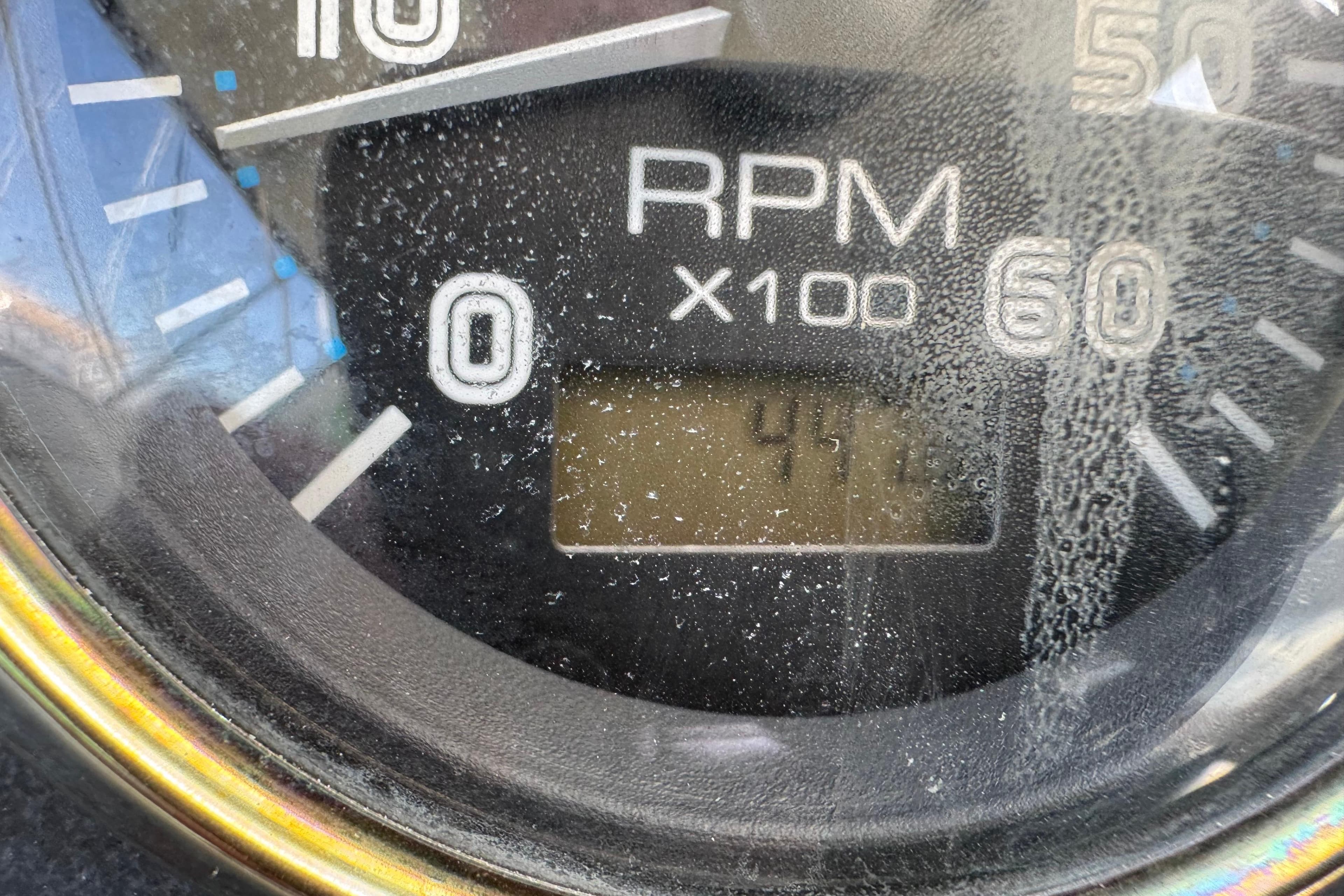 Close-up of a 2004 Carver 396 Motor Yacht RPM gauge displaying 417.5.