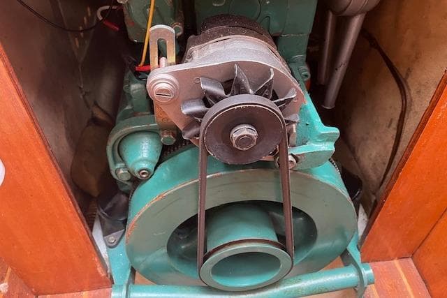 1982 Chaser 39 engine, close-up view showing belt and fan components.