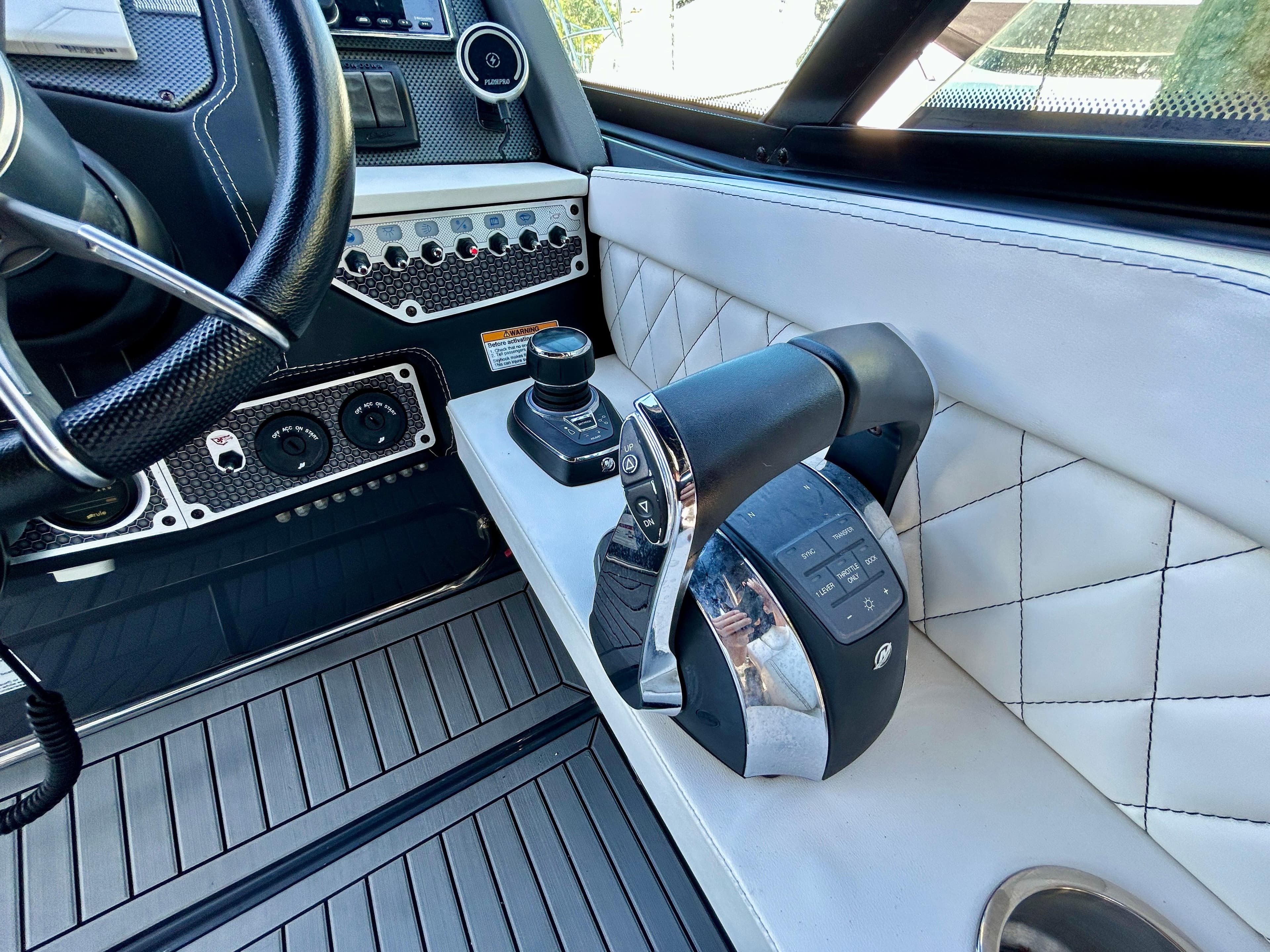 2021 Cruisers Yachts 338 South Beach Edition Bow Rider cockpit with modern controls and luxurious design.