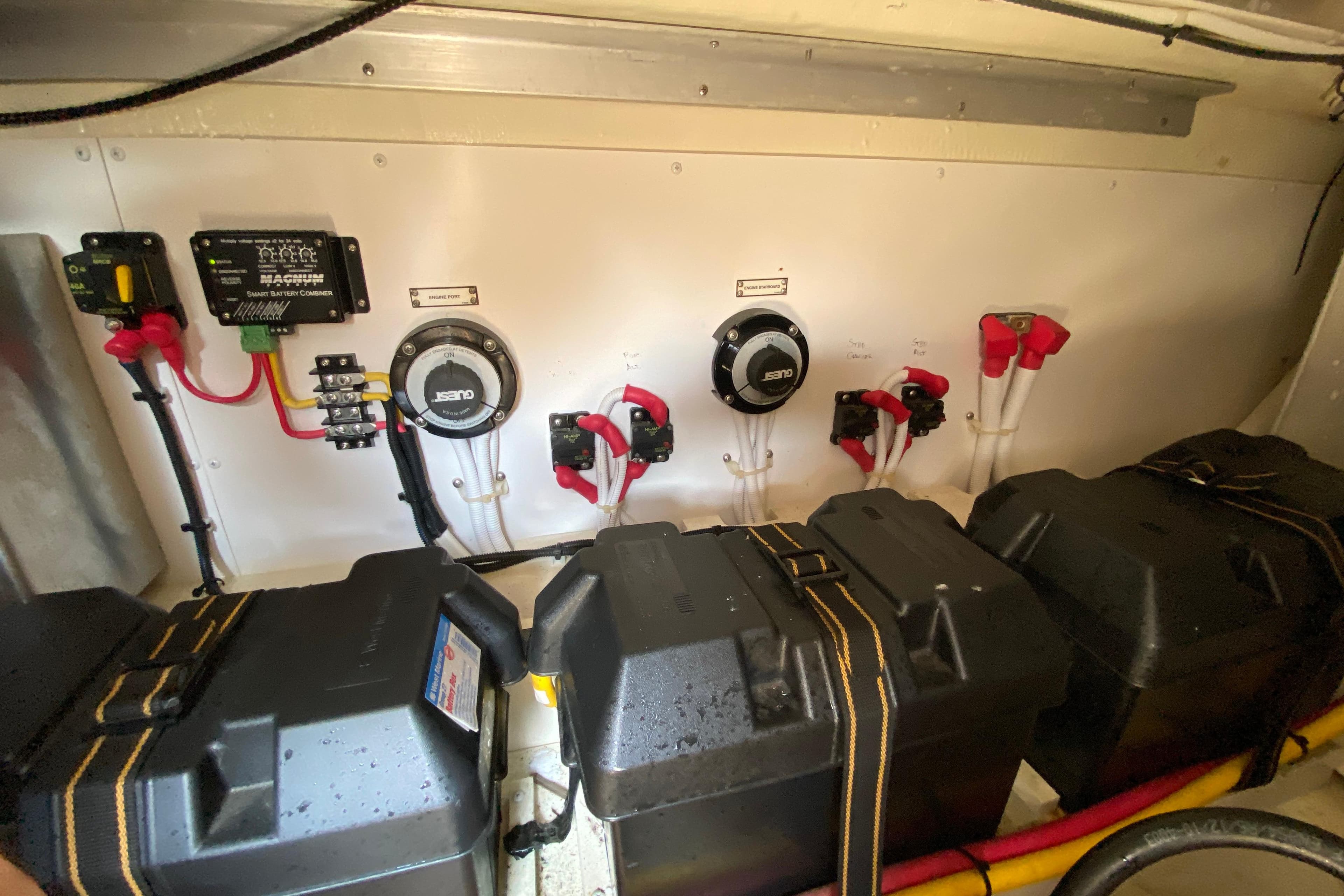 Electrical system of a 2004 Carver 36 Super Sport boat, featuring battery chargers and connections.