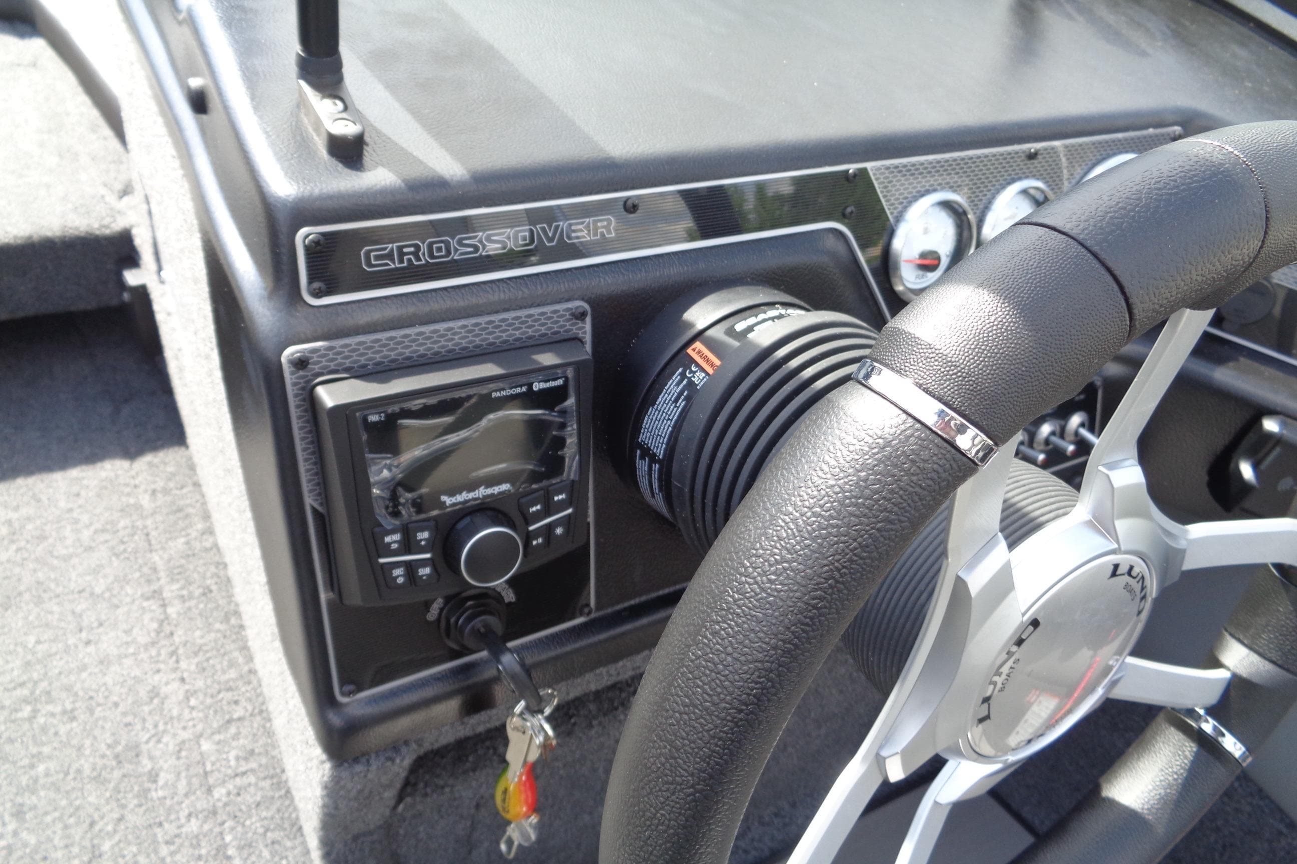 2026 Lund 1875 Crossover XS dashboard with steering wheel and control panel.